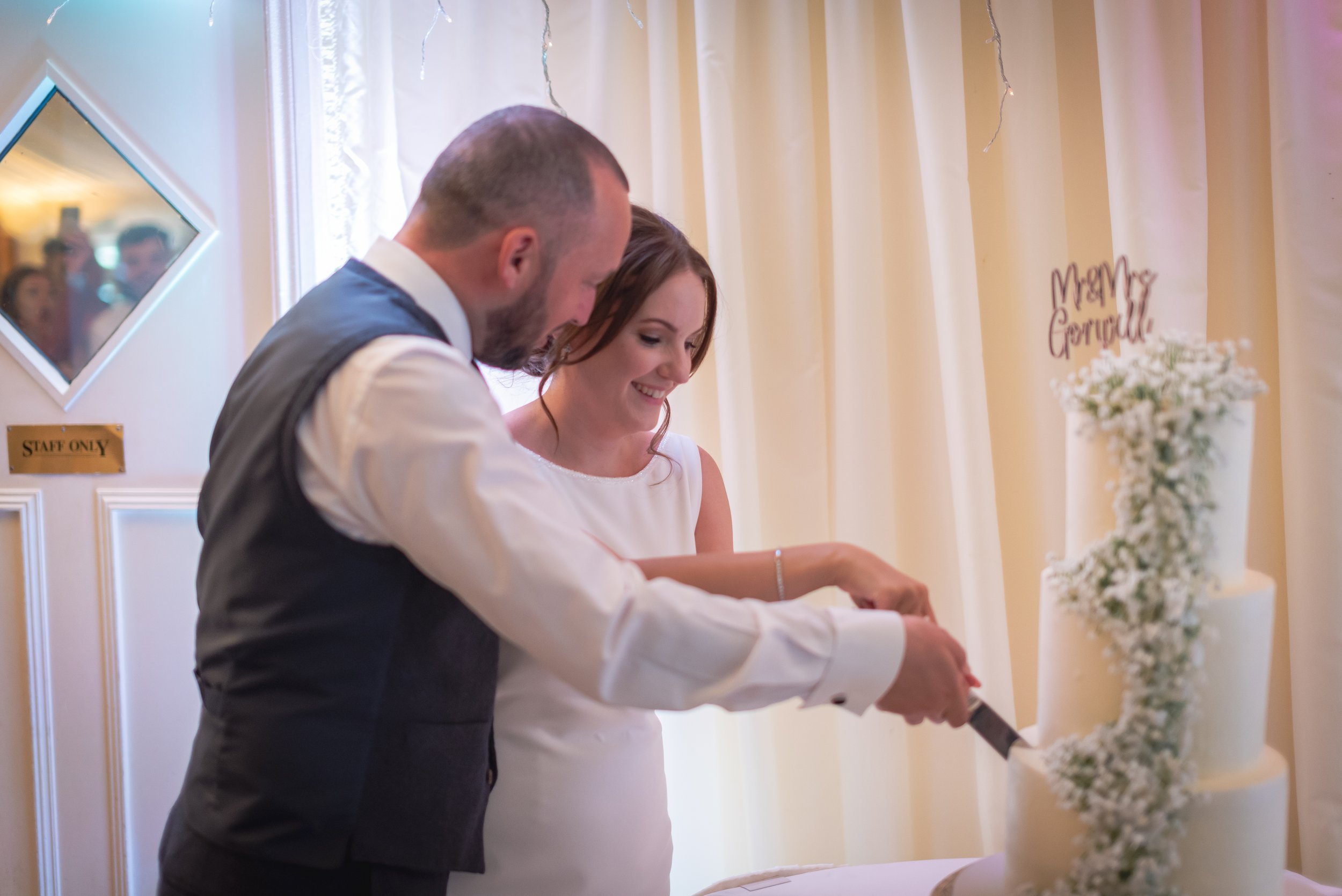 Bride and Groom cutting the cake for the guests at Batch Country House
