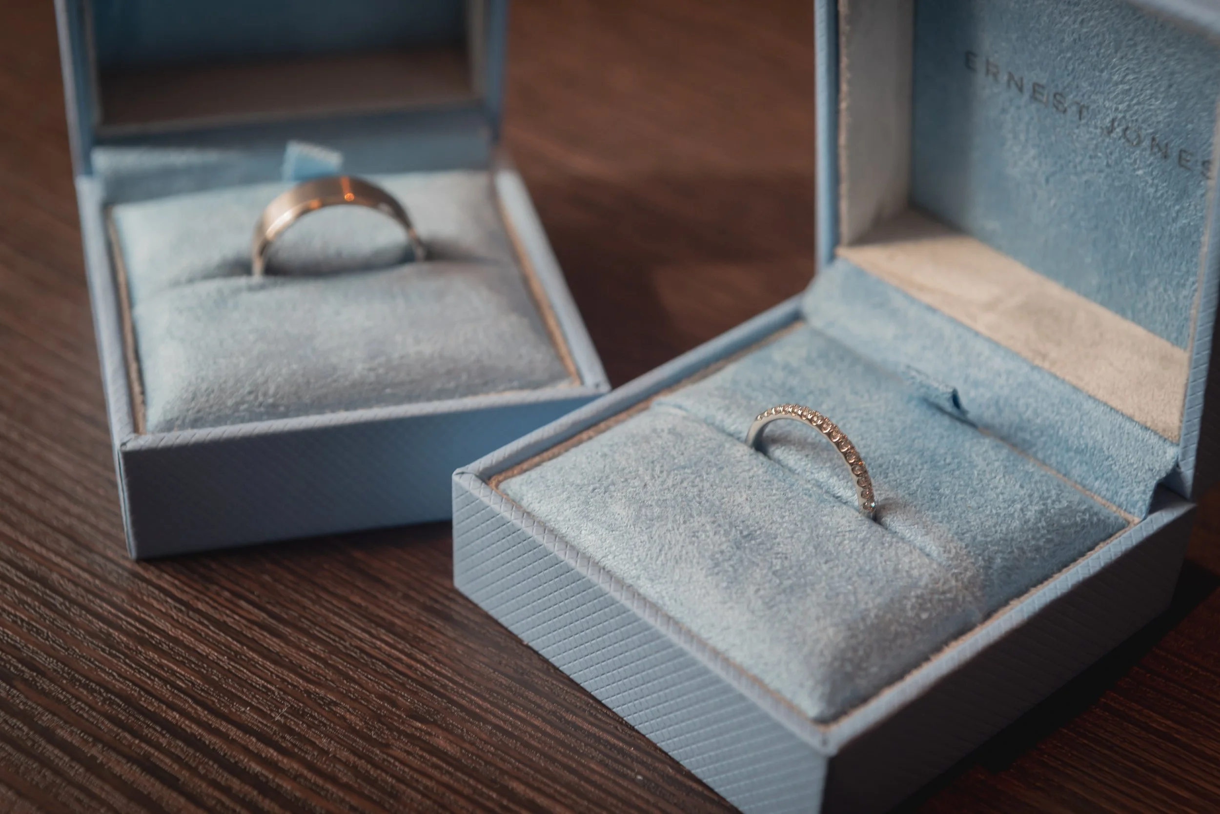 Bride and Grooms wedding bands displayed in the wedding ring case