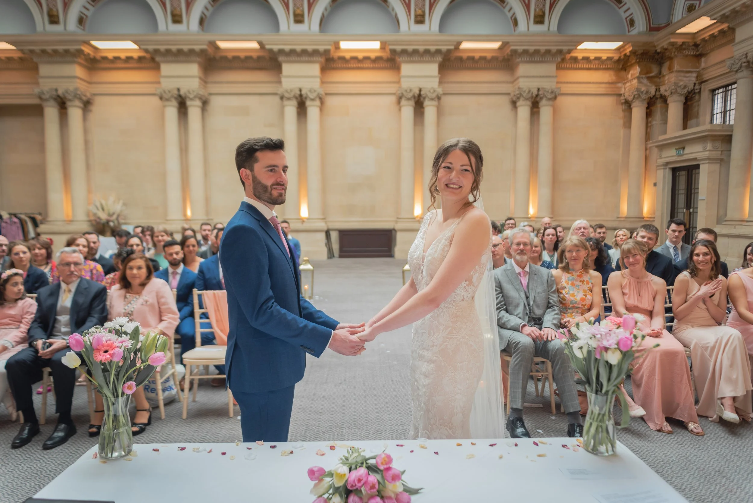 Bride and Groom holding hands at Bristol Harbour Hotel