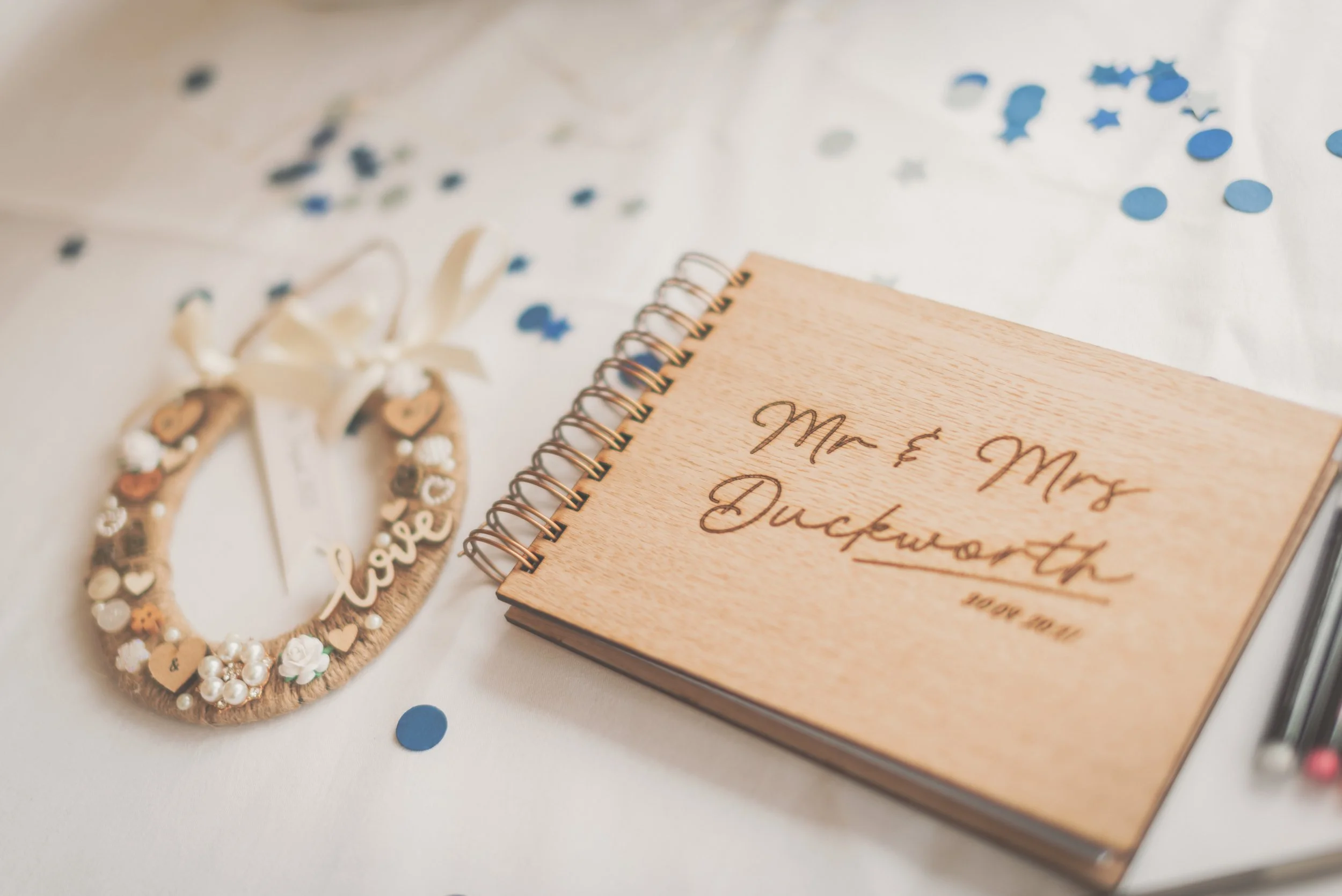 Flatlay of horseshoe and signature book for wedding at Aldwick Estate