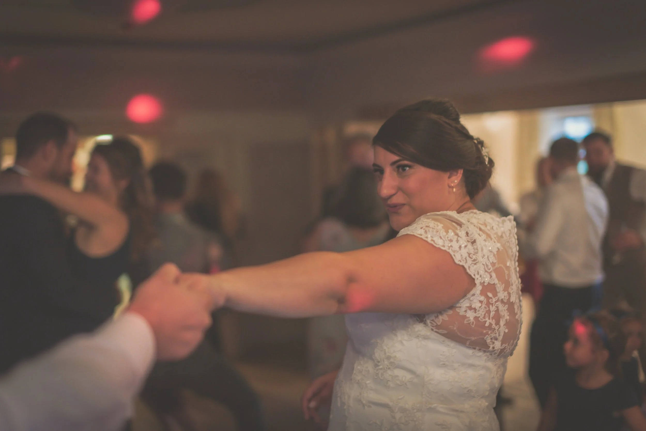 Dancing the night away the bride prepares to be swung around at Aldwick Estate