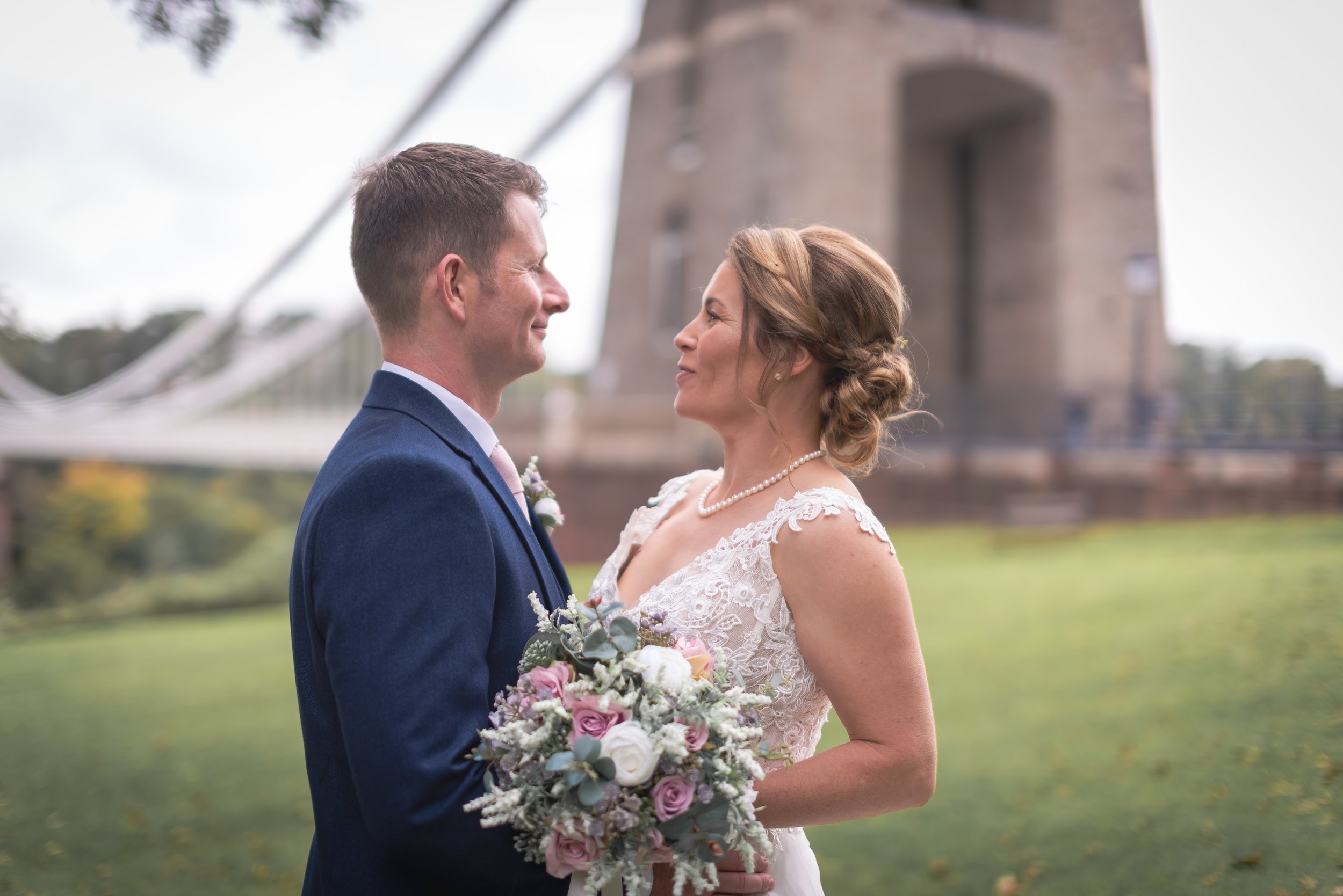 Bride and groom sharing a kiss at golden hour in Bristol