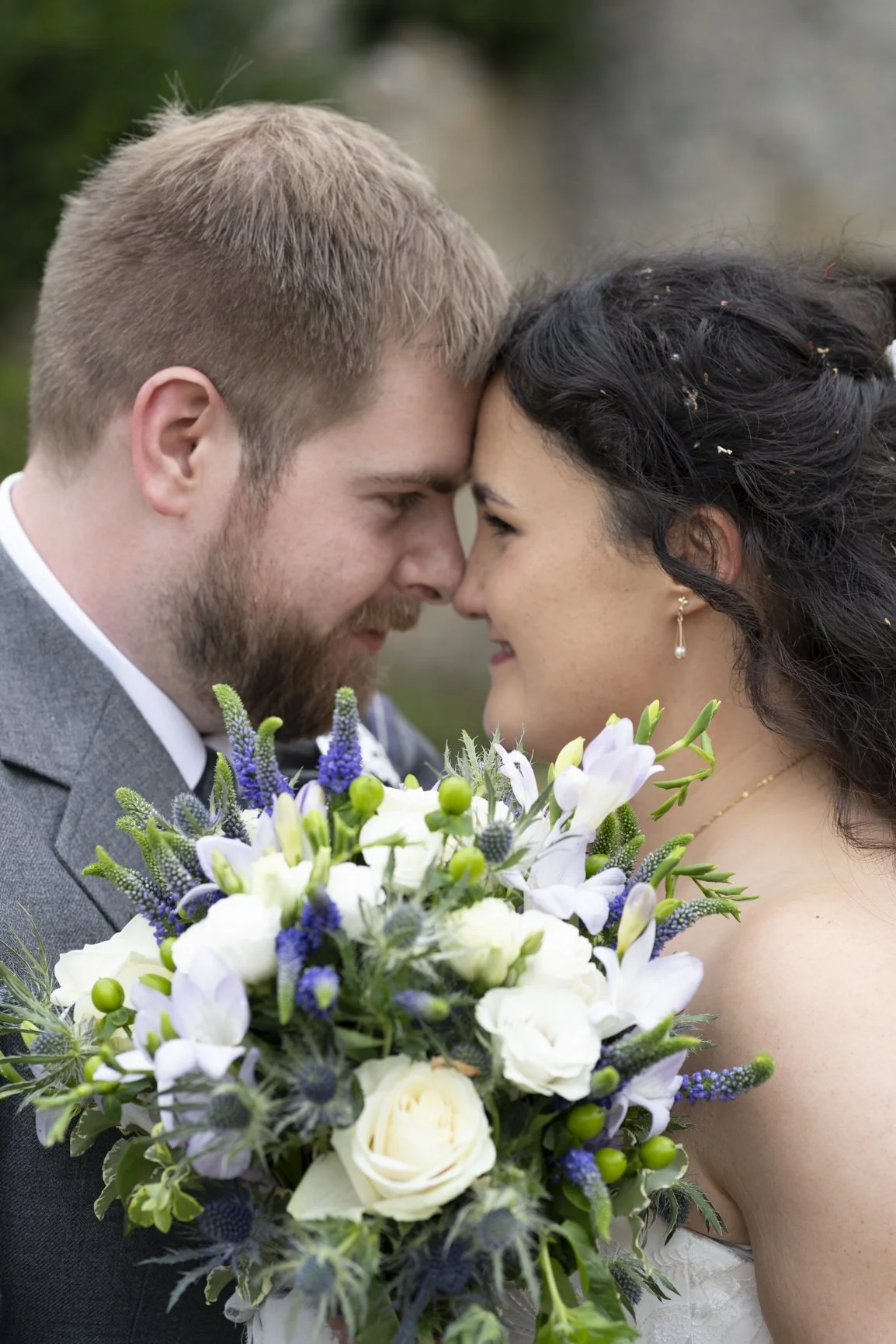 Bride and Groom at Priston Mill, holding each other close during their wedding taken during wedding photography in Bath