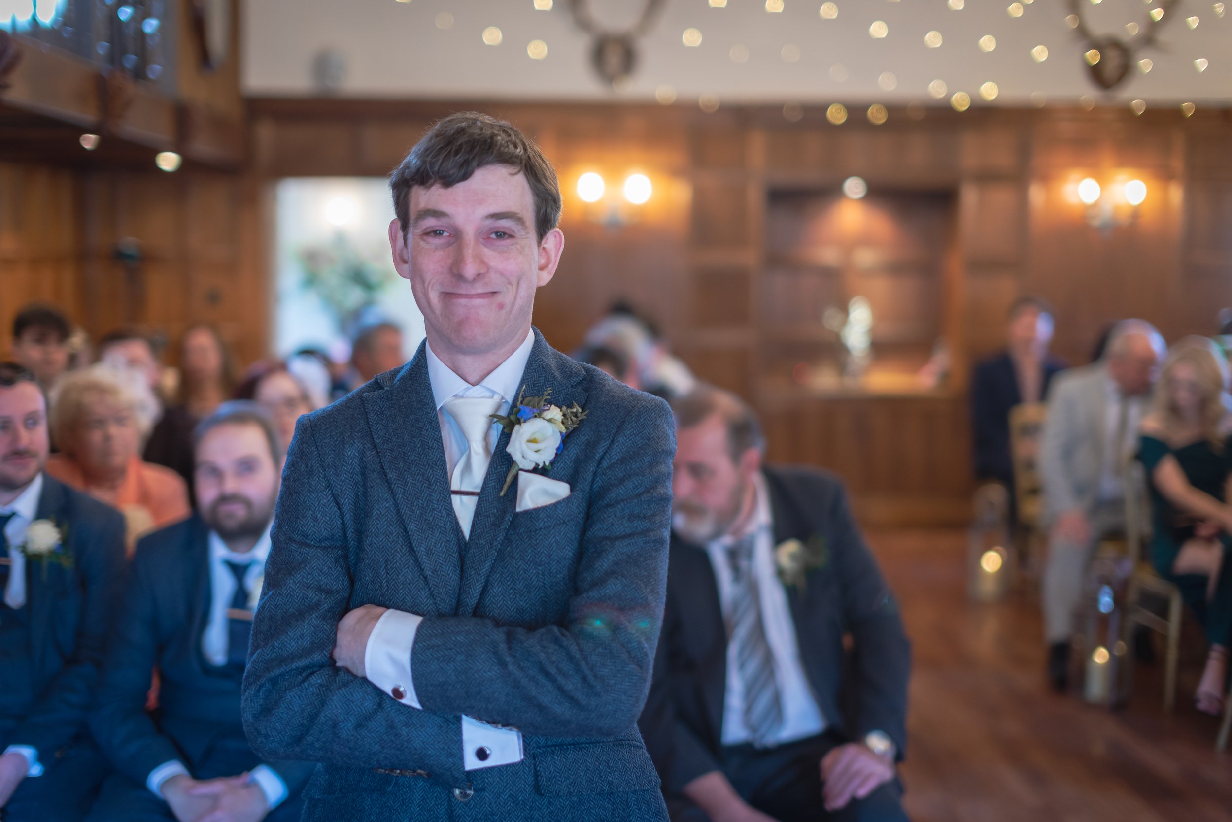Groom waiting for bride to walk down the aisle at Deer Park Hall