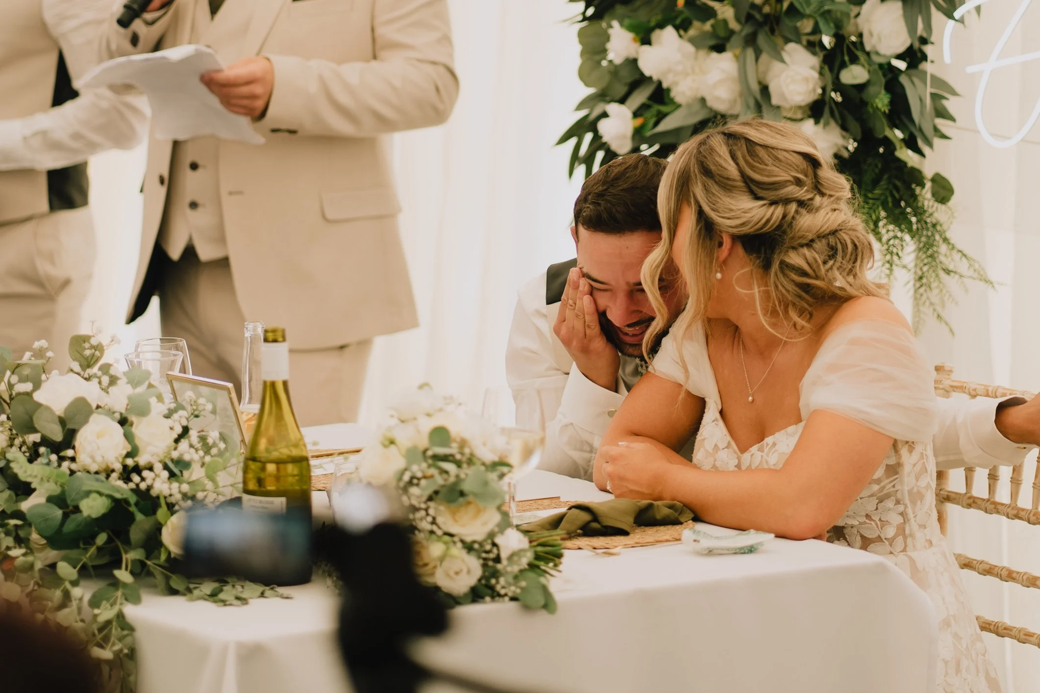 Groom in hysterics during best man’s speech at Lapwing Farm, natural reaction photo during wedding reception