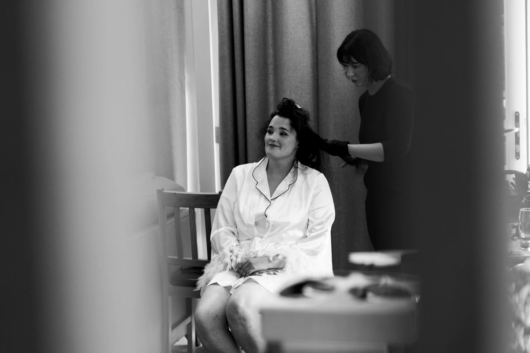 Bride having her hair done by team at Bath Lodge Retreat before her wedding
