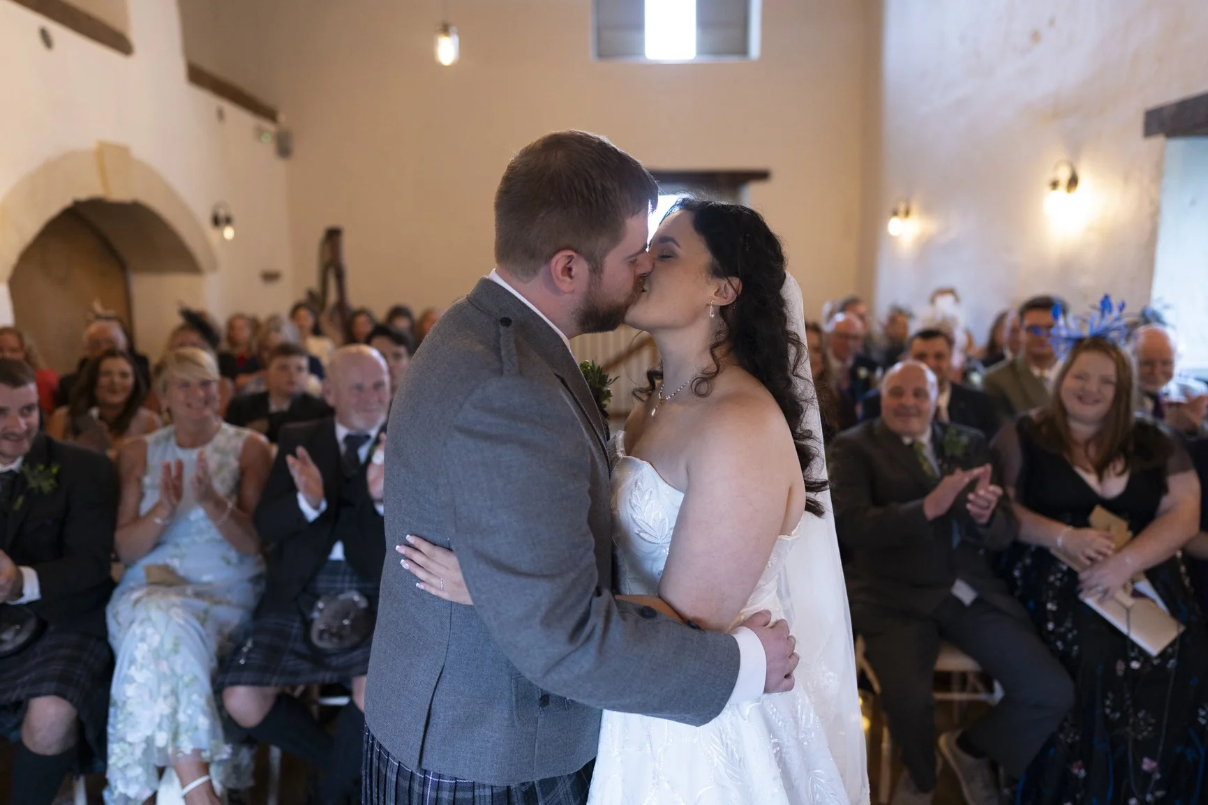 Bride and Groom kissing after wedding ceremony at Bath Priston Mill