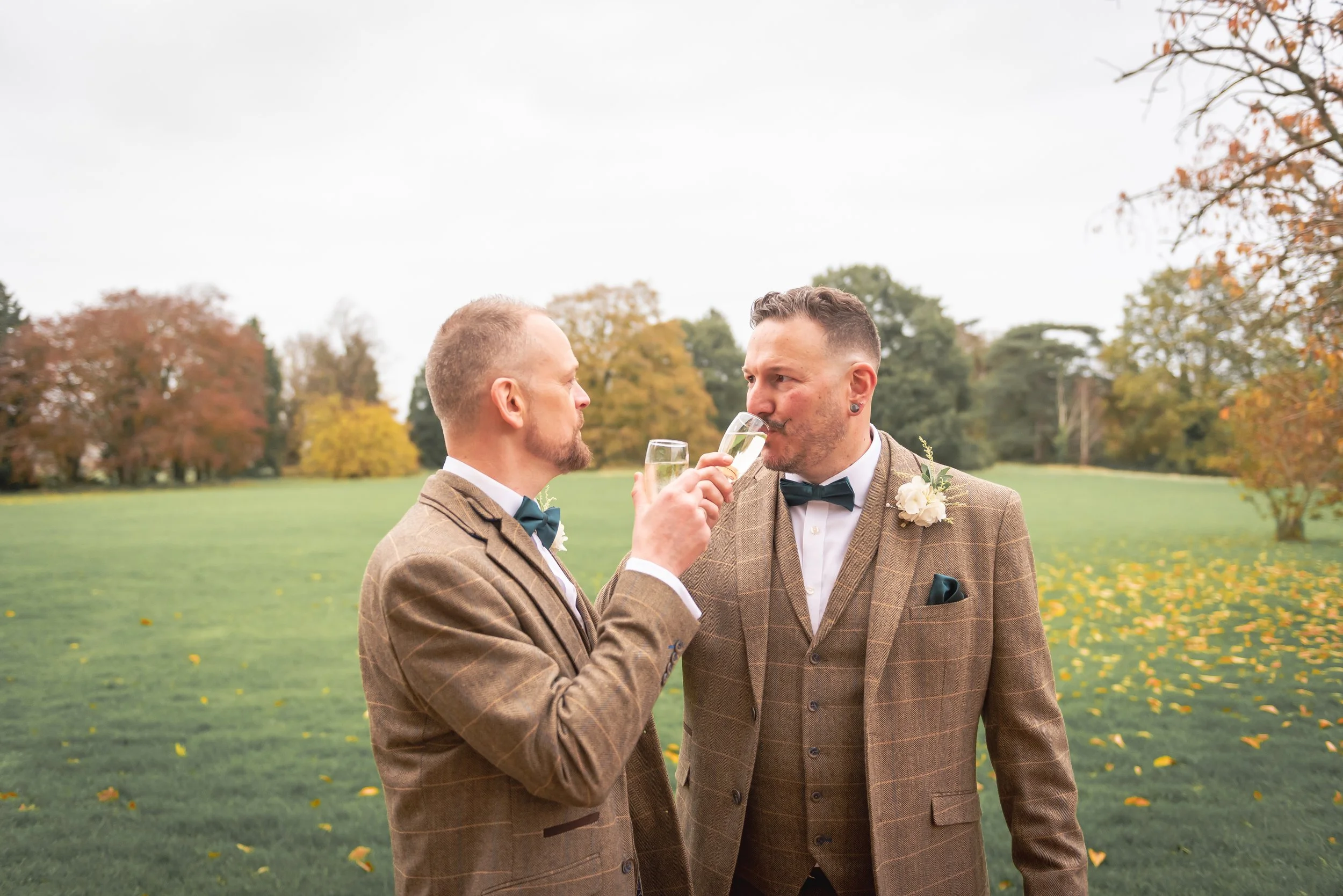 Relaxed shot of Andy and Issac enjoying a glass of fizz together during the drinks reception.