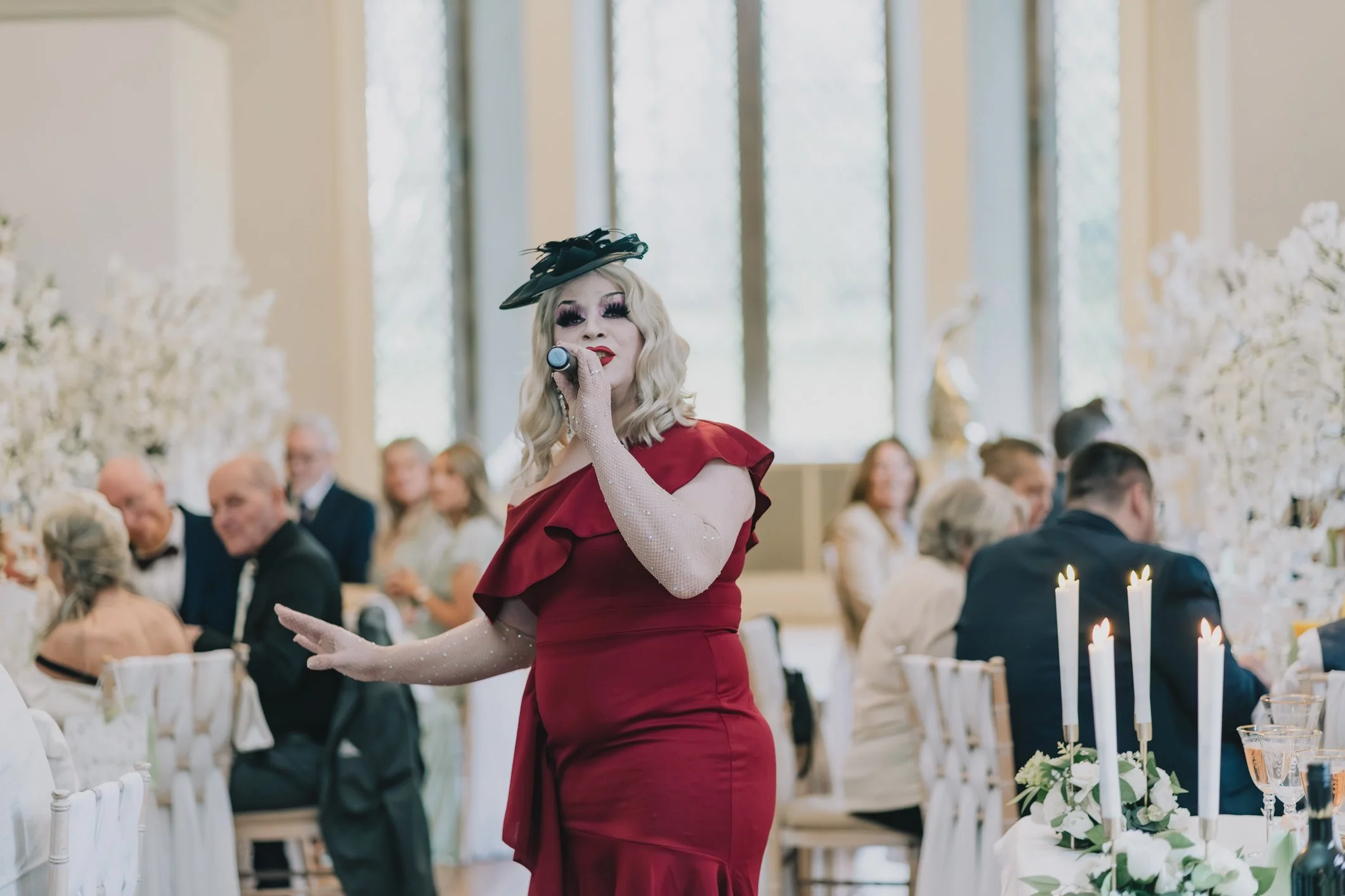 Drag artist at Clearwell Castle performing during wedding breakfast