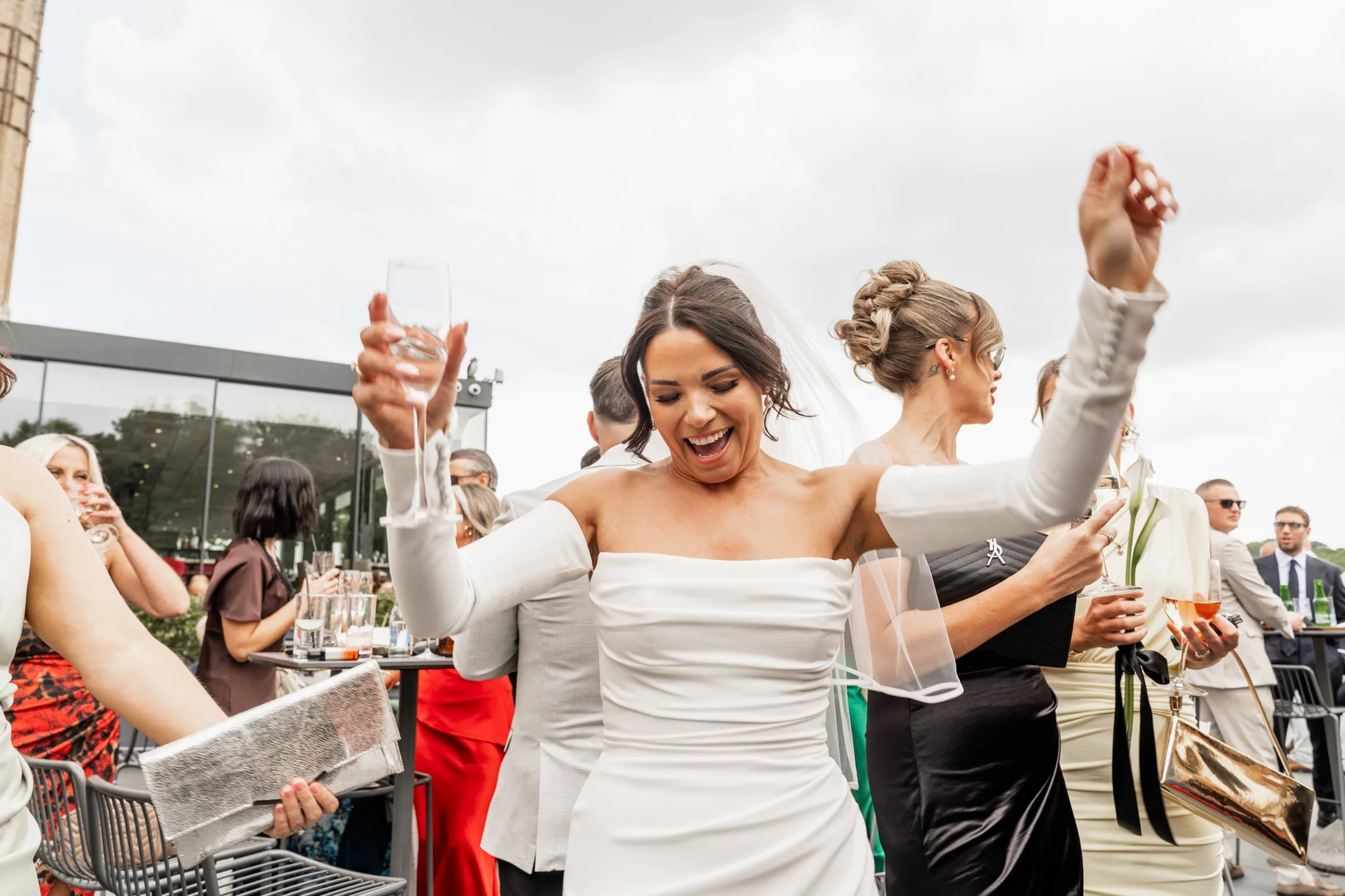 Bride dancing during her wedding reception on Avon Gorge Terrace