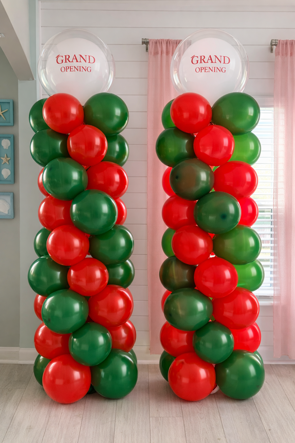 Balloon columns with red and green balloons and clear balloons on top that read 'Grand Opening' for a celebration.