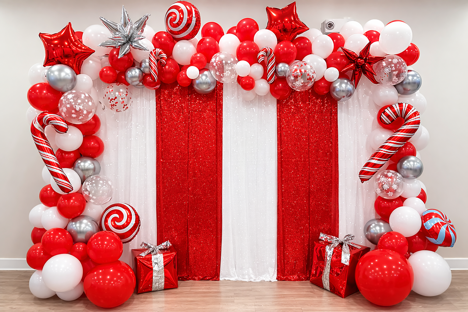 Christmas balloon decoration with red, white, and silver balloons, including candy cane-shaped balloons, gift boxes, and star-shaped balloons, with red and white curtains in the background.