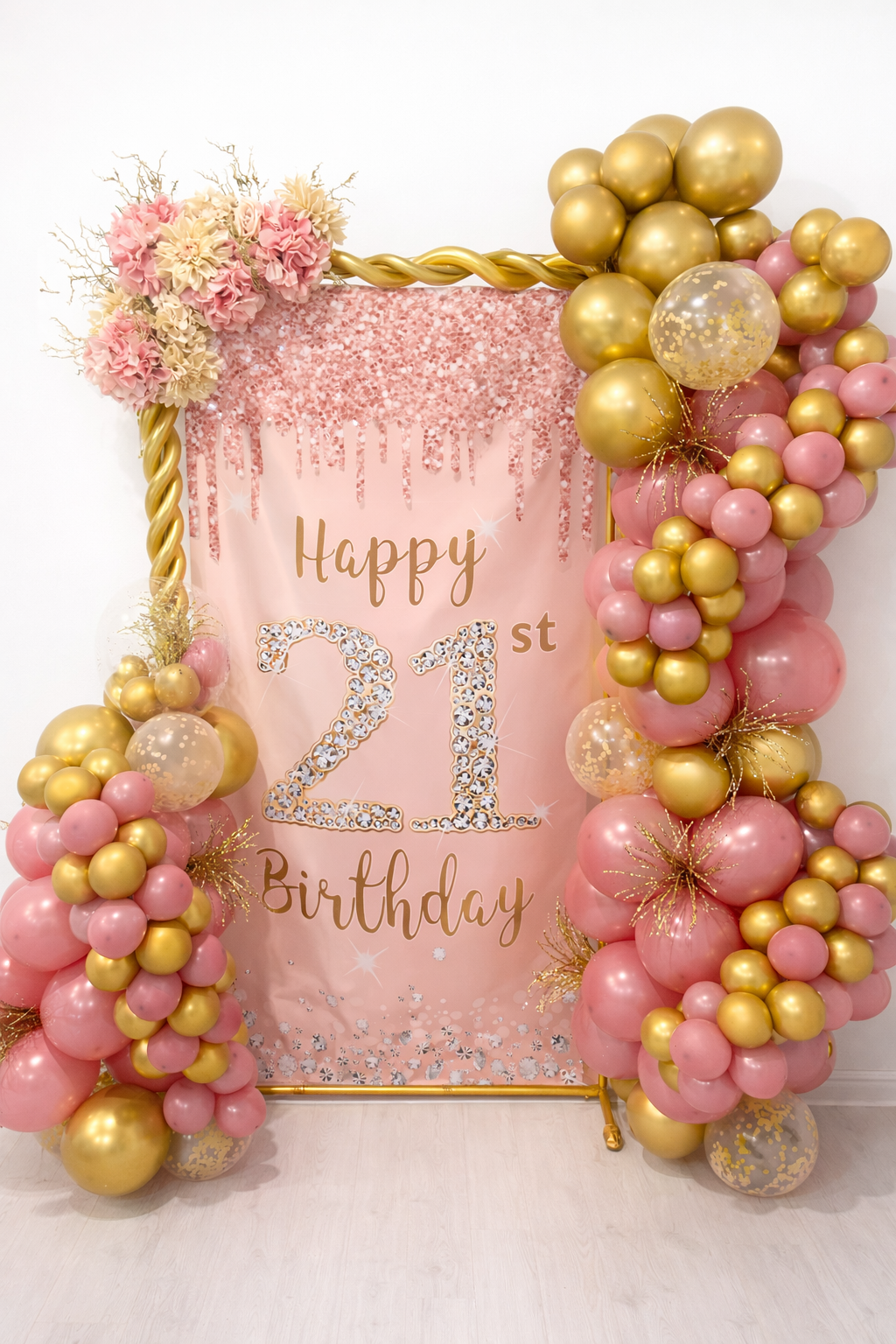 Pink birthday banner with gold and pink balloon decorations, flowers, and the words "Happy 21st Birthday."