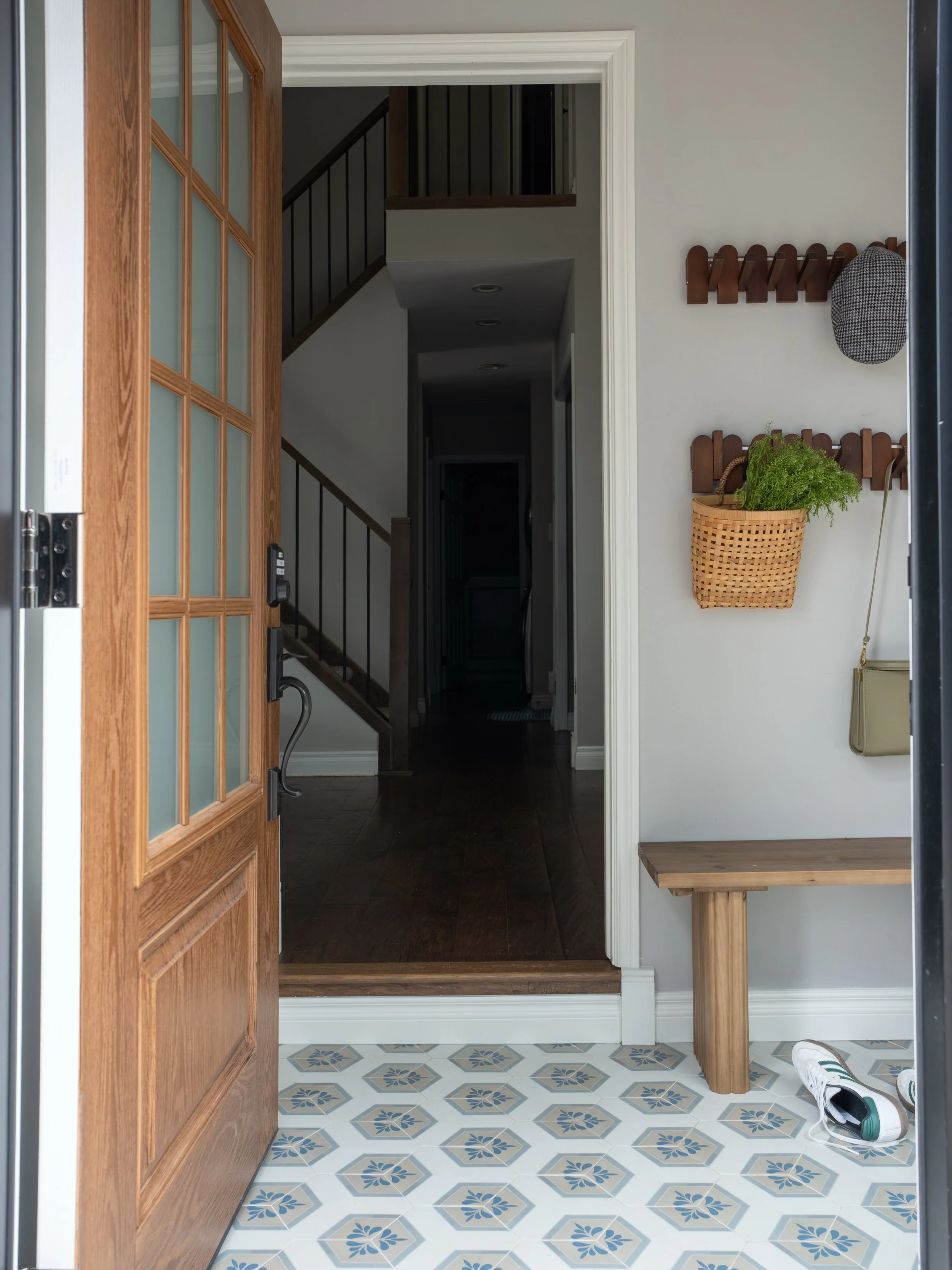Small changes but a big impact. This vestibule wasn&rsquo;t the clients main point of entry for everyday but it was where guests would enter. A charming vintage inspired tile and some practical accessories transformed this into a welcoming spot for g