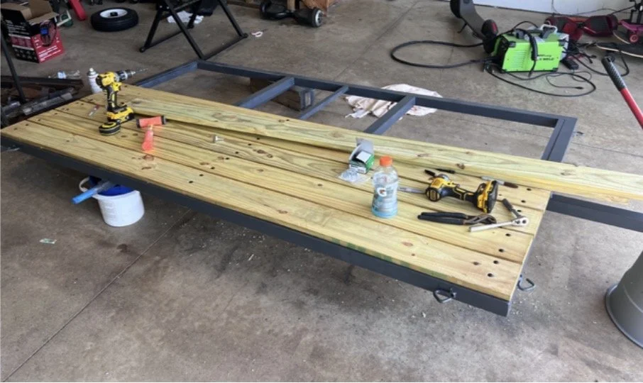 Custom single axle lawn mower utility trailer fabricated from tubular steel in Milford MI