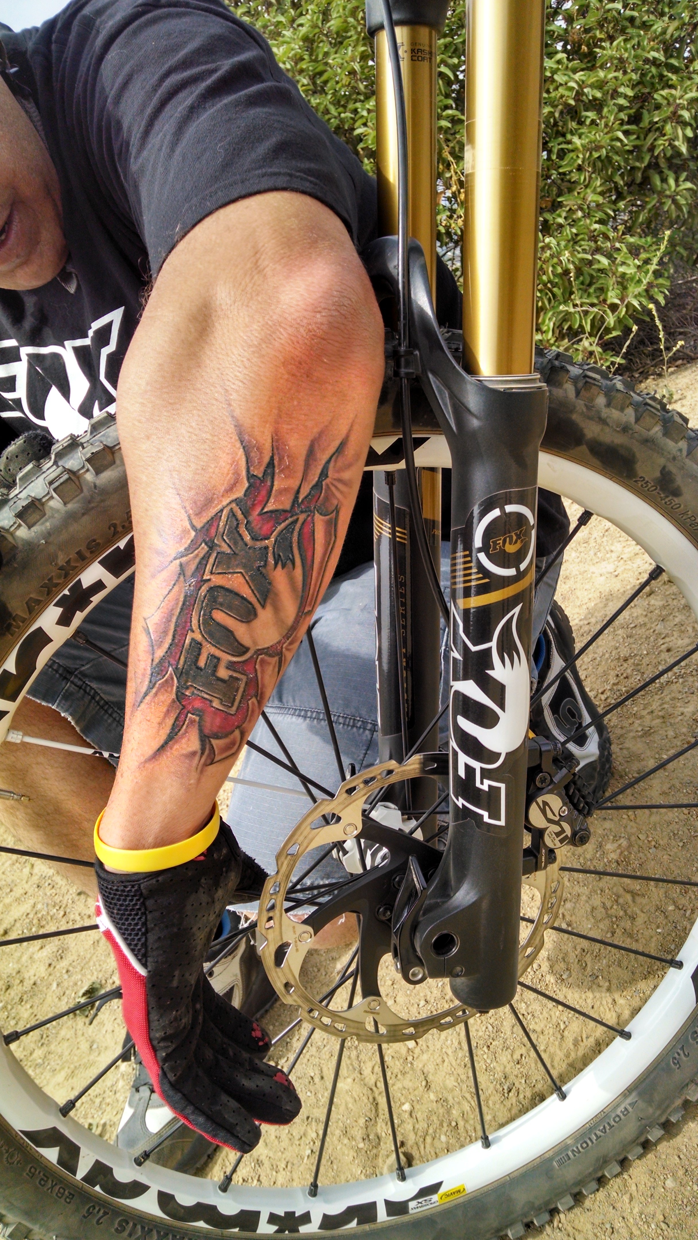 Passionate FOX Factory customer with the FOX logo tattooed on his left forearm.