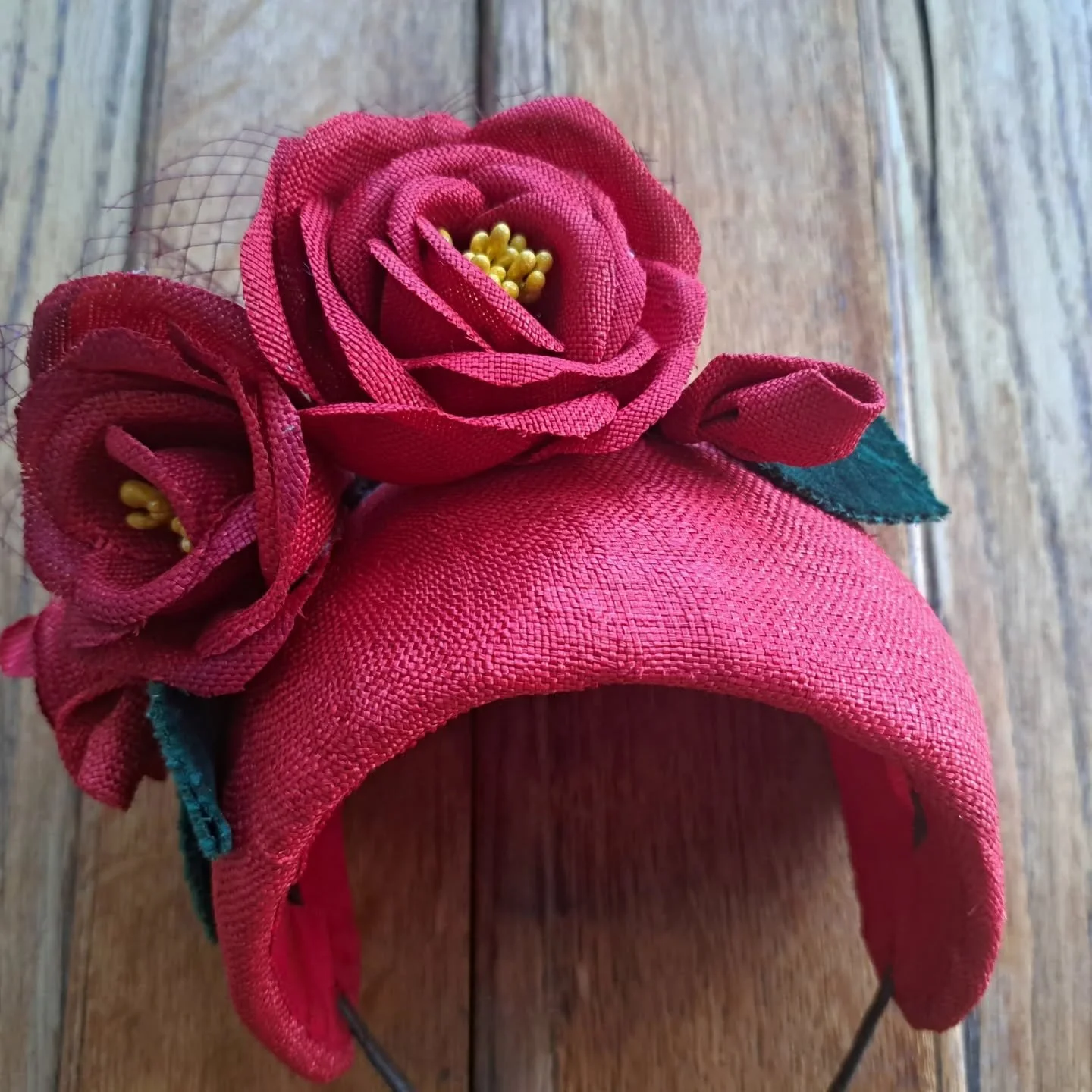 Re-purposed vintage parasisal fabric hat, now a headband with some handmade roses, leaves and deep red colour net. x