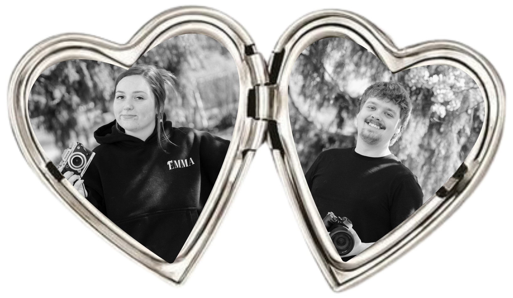 Black and white photo of a young woman and man holding cameras, positioned behind overlapping heart-shaped mirror frames, outdoors with trees in the background. The woman wears a hoodie with 'EMMA' written on it, and the man has curly hair and a goatee, smiling.