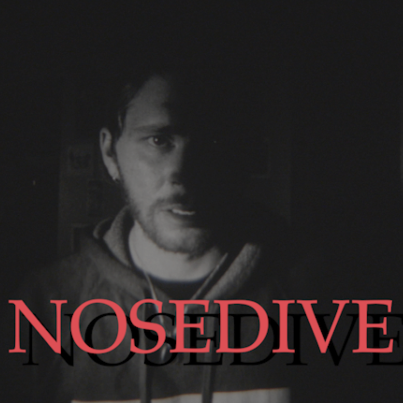 Black and white image of a young man with dark hair and beard, partially obscured by shadows, with the word 'NOSEDIVE' in red letters across the bottom.