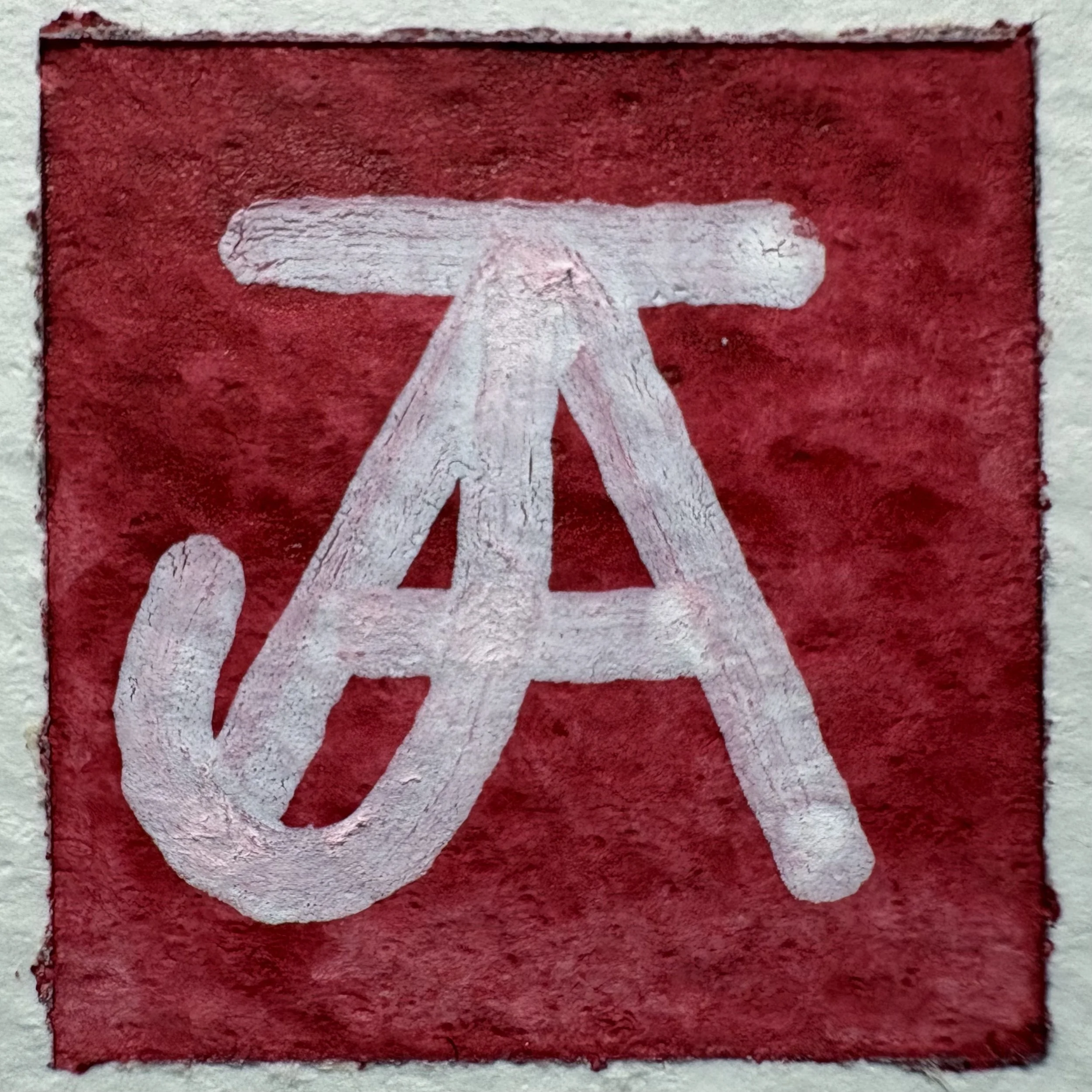 Andy Johnson's signature, a capital A superimposed with a capital J