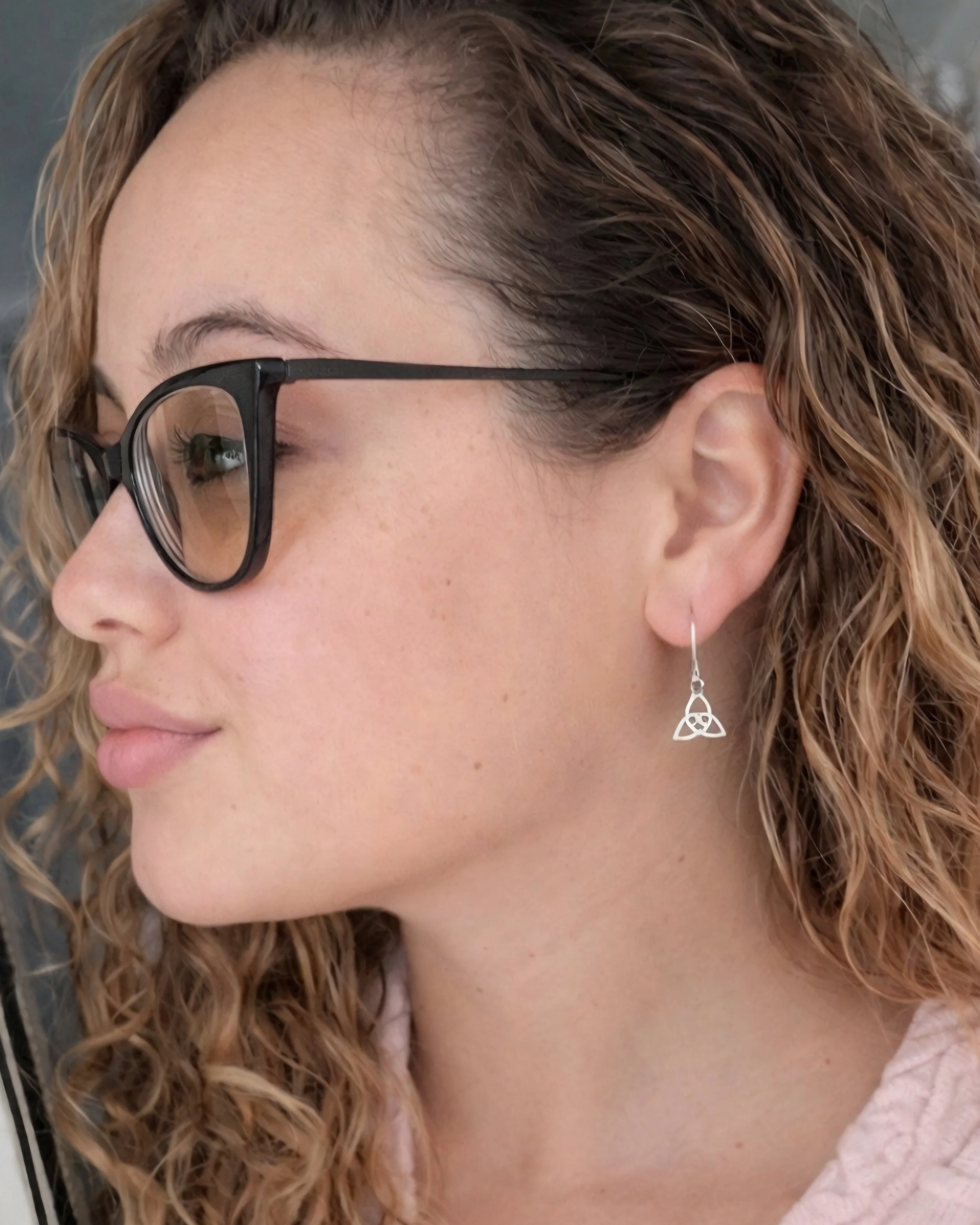 jazz wearing triquetra earrings.jpg