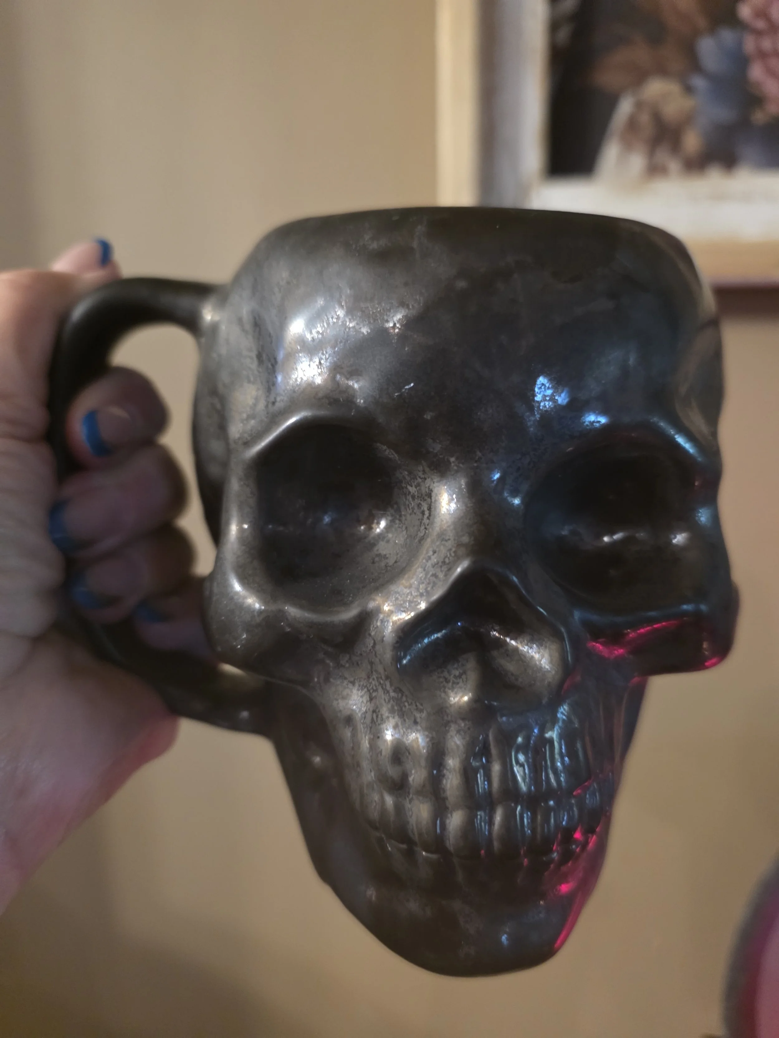 me holding skull mug.jpg