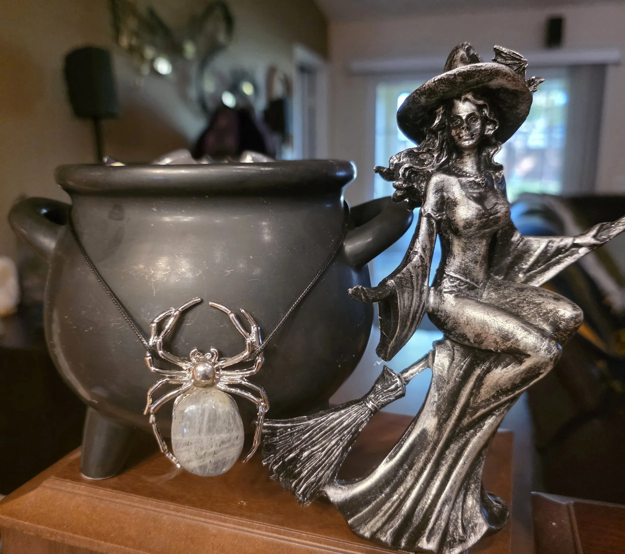 cauldron candle wit witch home background.jpg