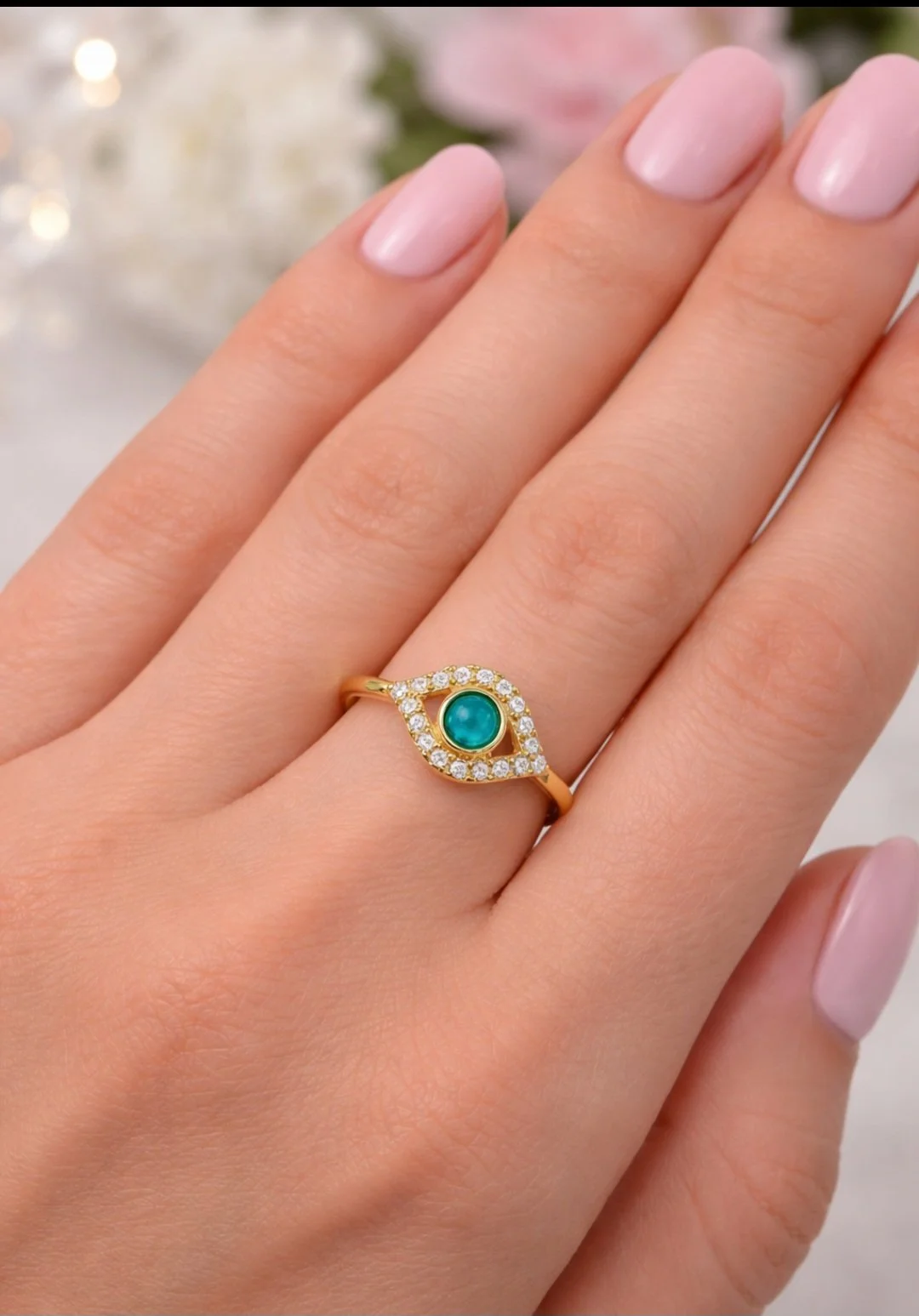 gold turquise eye ring on hand.jpg