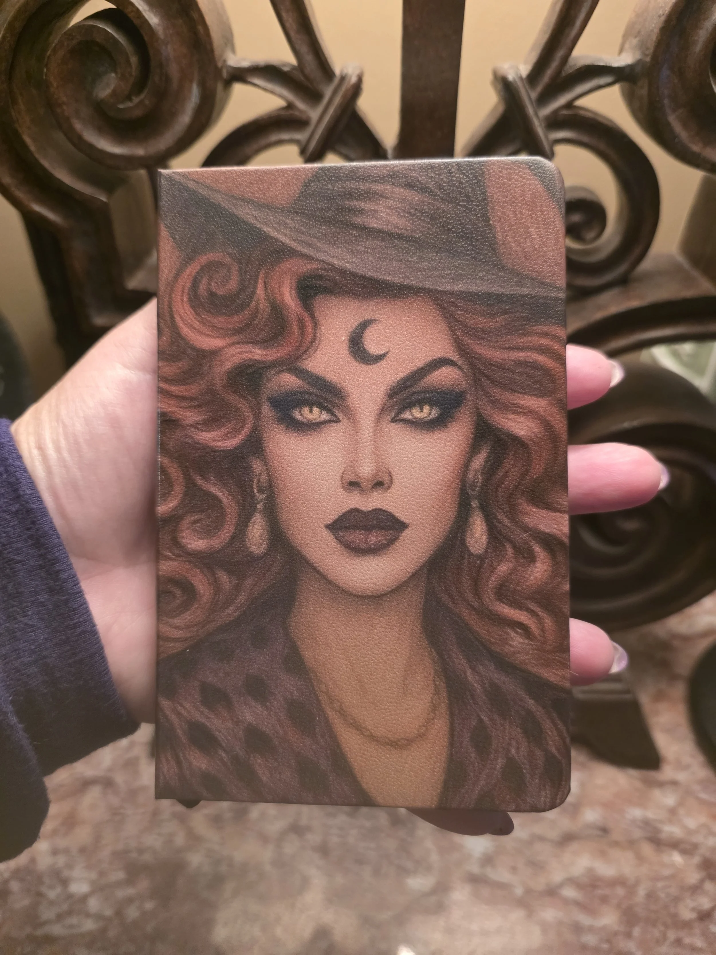 holding small stella journal.jpg