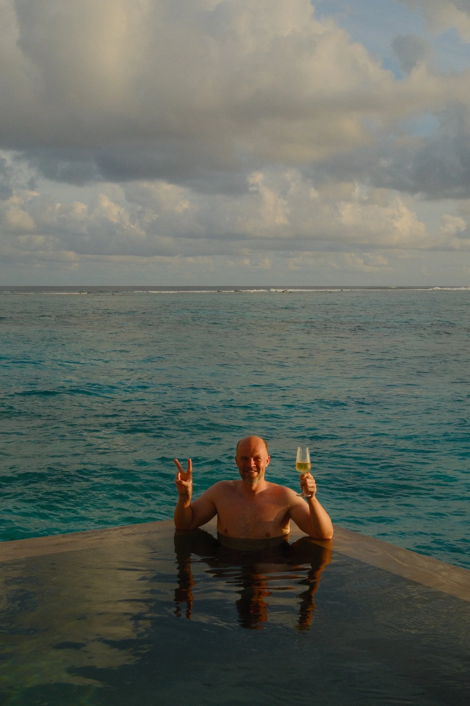 Infinity pool sunset in the Maldives | Matt and Wahyu Travel