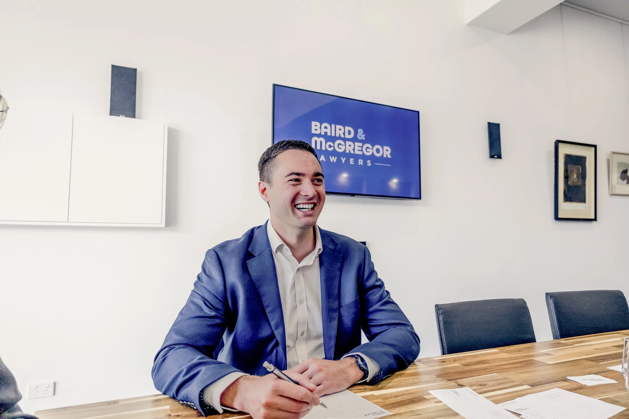 Tom Keightley, Lawyer seated at a conference table in the Baird & McGregor office