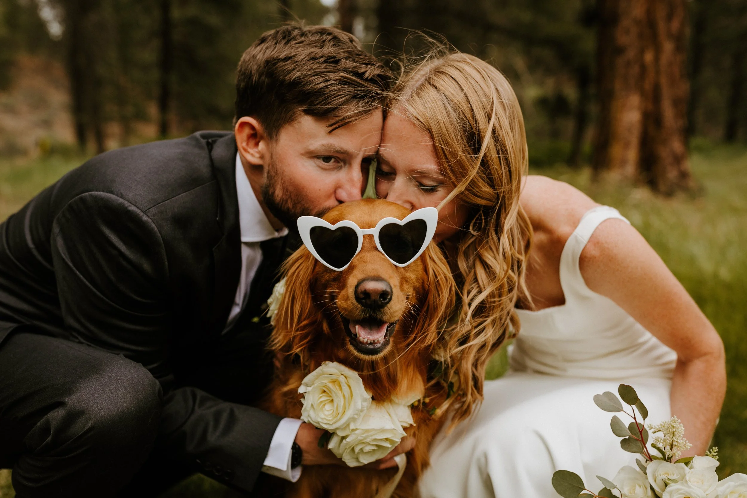Bride and groom posing with their dog during wedding portraits in Bend, Oregon — Photo by Victoria Carlson Photography