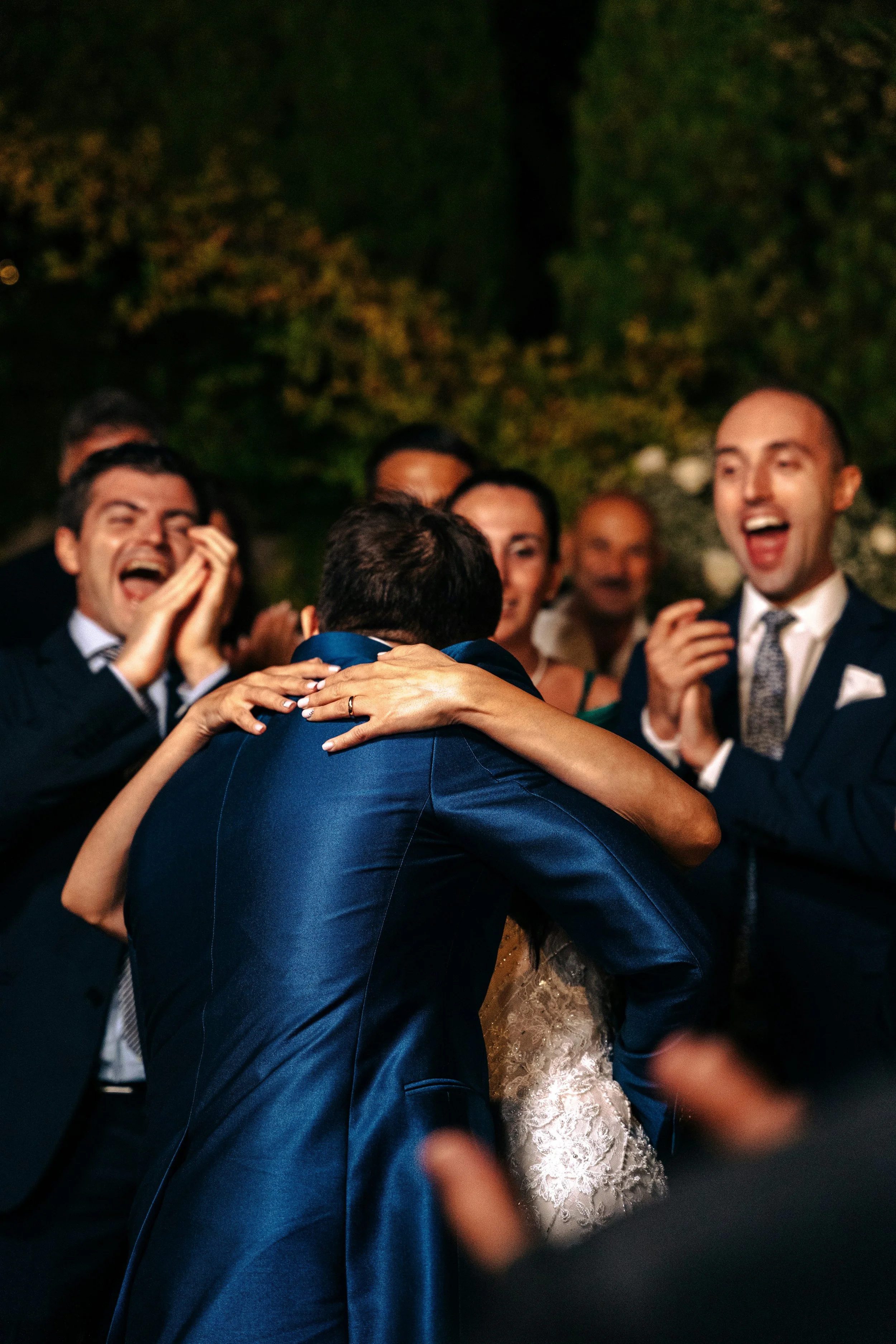 Wedding Couple surrounded by guests cheering