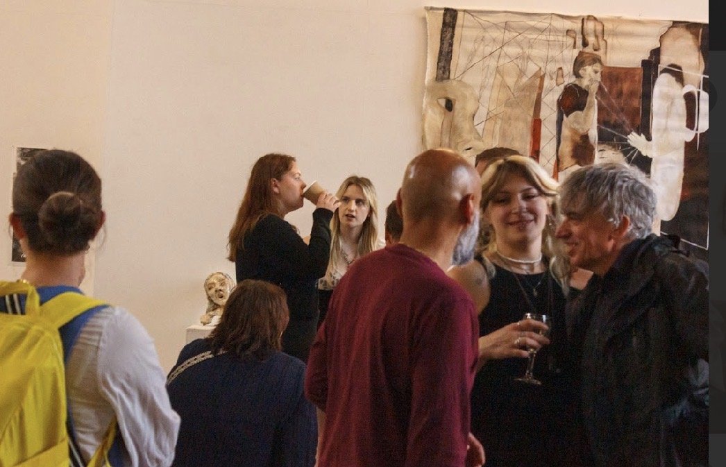 group of visitors networking at exhibition