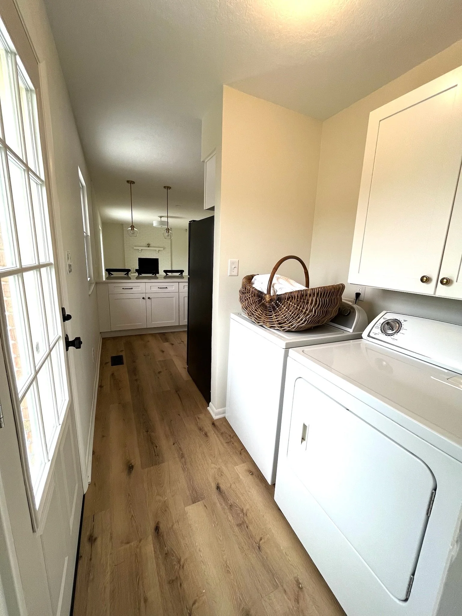 The laundry area is conveniently located between the kitchen and bedrooms. 
