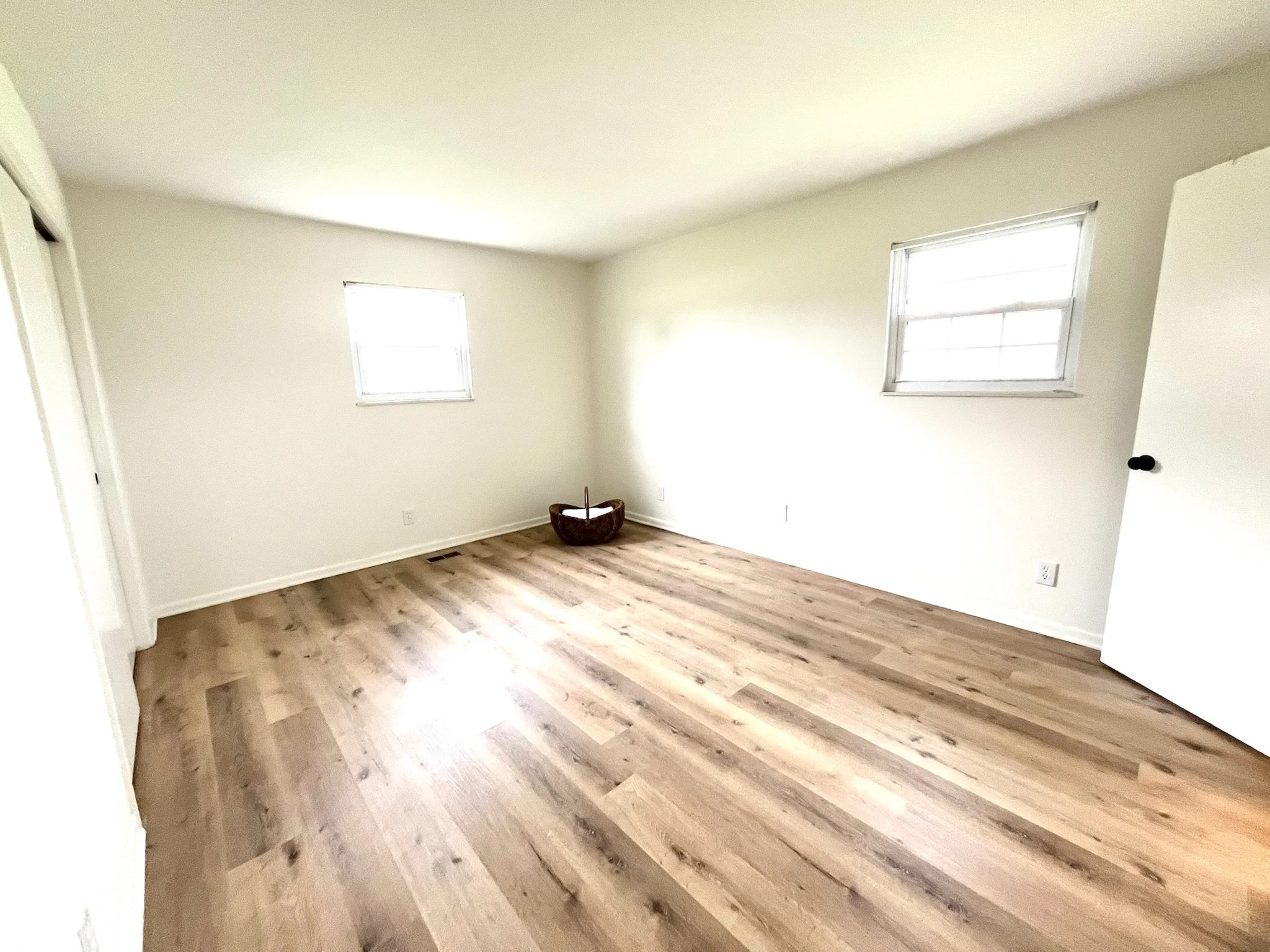 The spacious primary bedroom boasts two closets, plenty of room for a king sized bed, and an ensuite bathroom with a new standup shower. The secondary bedrooms both have large closets and ample space. 