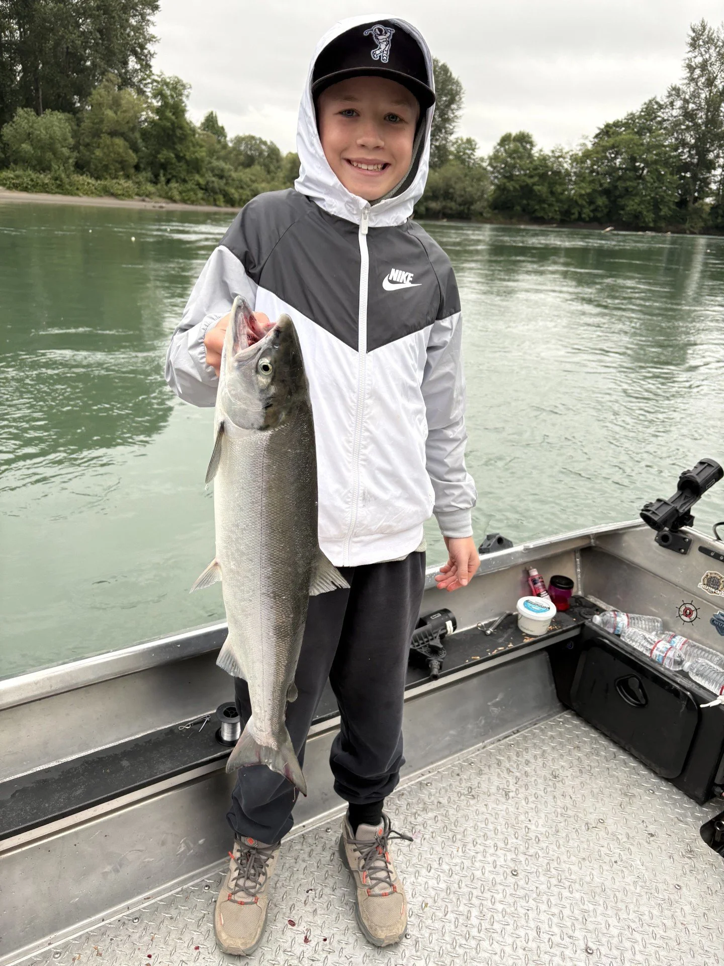 This young man's first salmon on the Skagit River with local fishing guide, Wyman Guide Service.