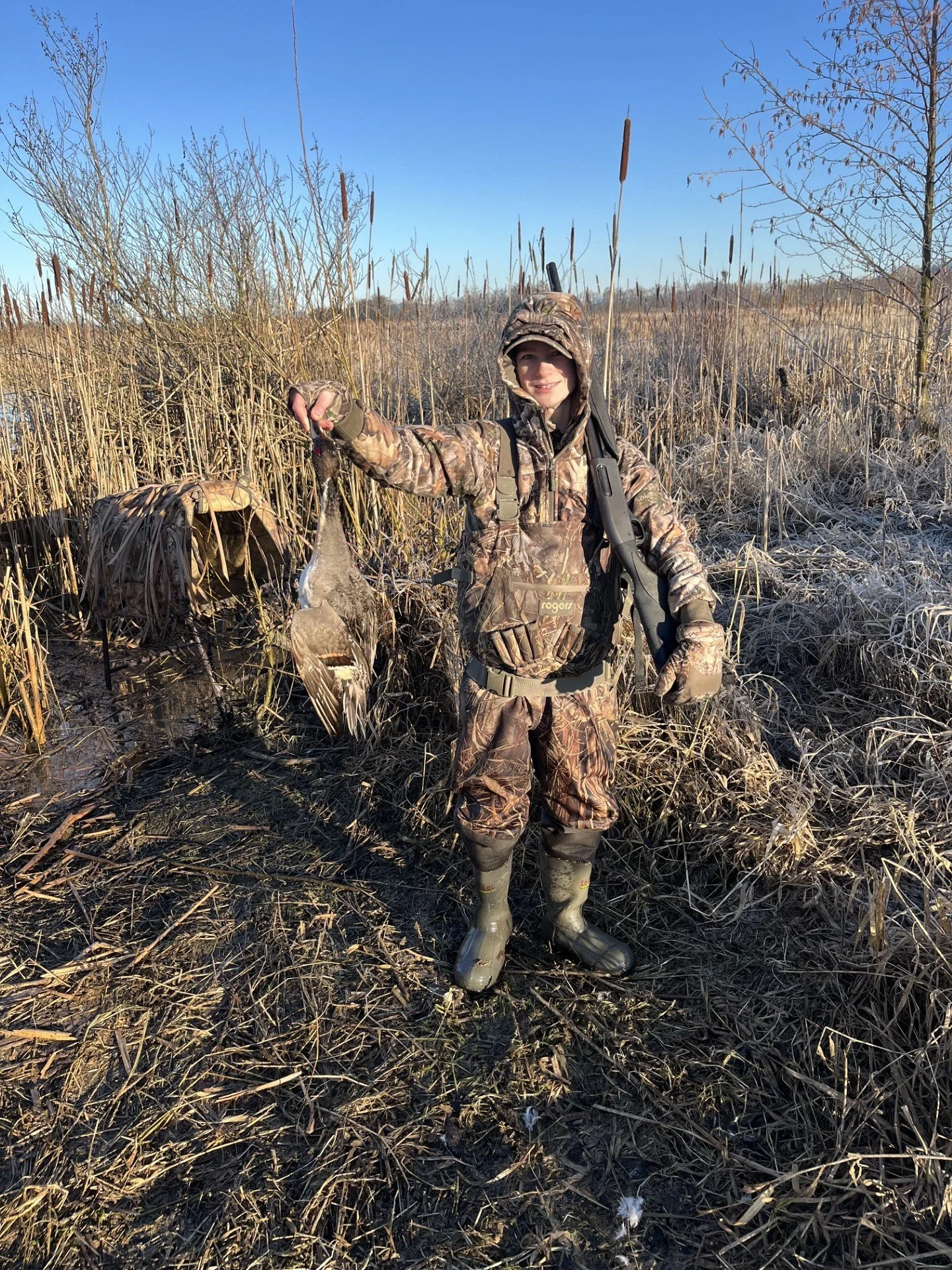 Tyler (the son of Wyman Guide Service) showing off a nicely-plumed pintail duck while hunting in the lower marshes of the Skagit River.
