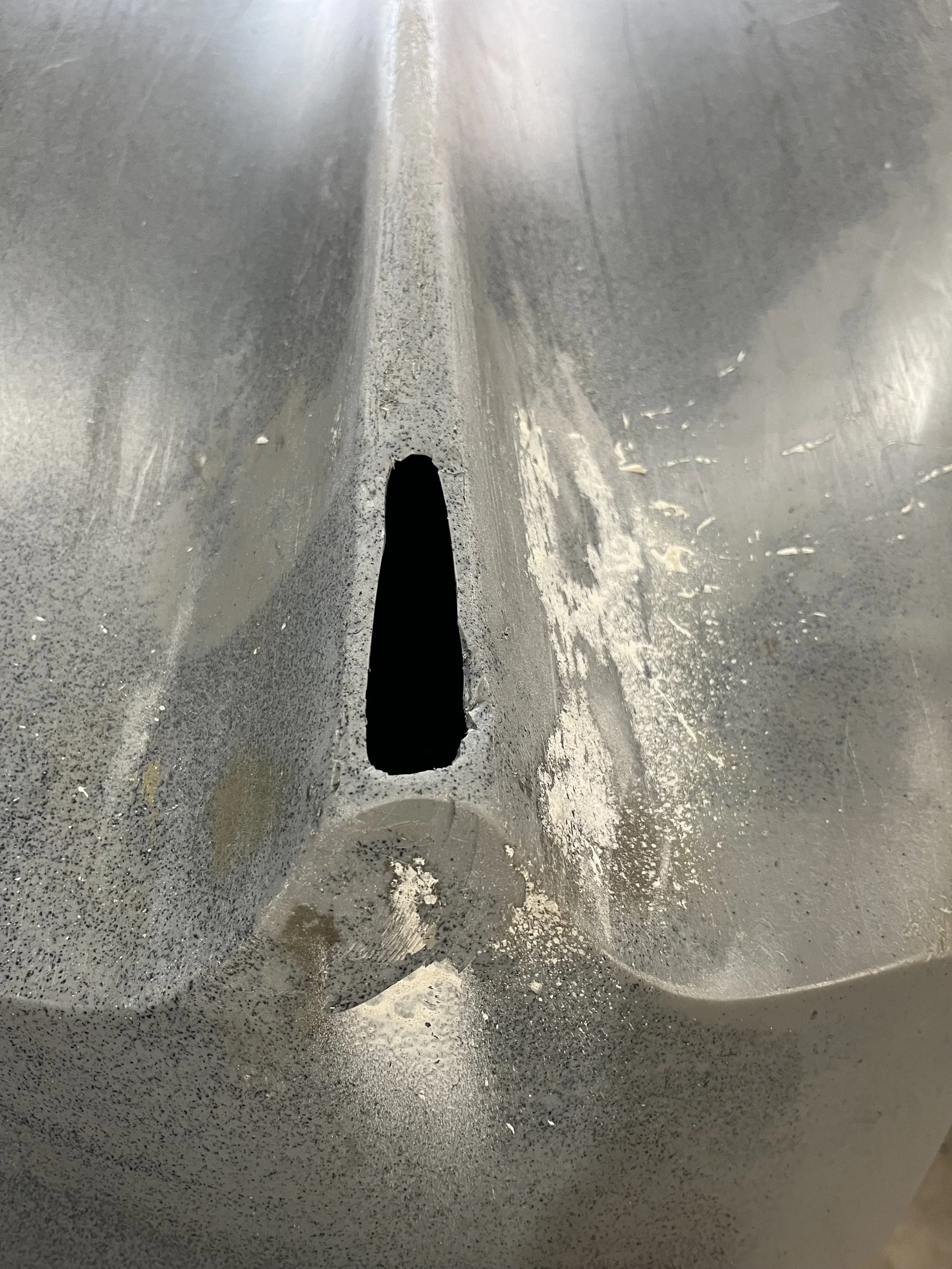 Damage to the keel of a rotomolded HDPE kayak.