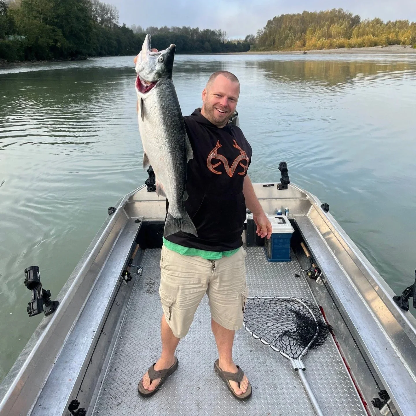 Your salmon guide with a stellar coho salmon (silver) on the Skagit River near Sedro Woolley.  Coho make for a great guided fishing trip.