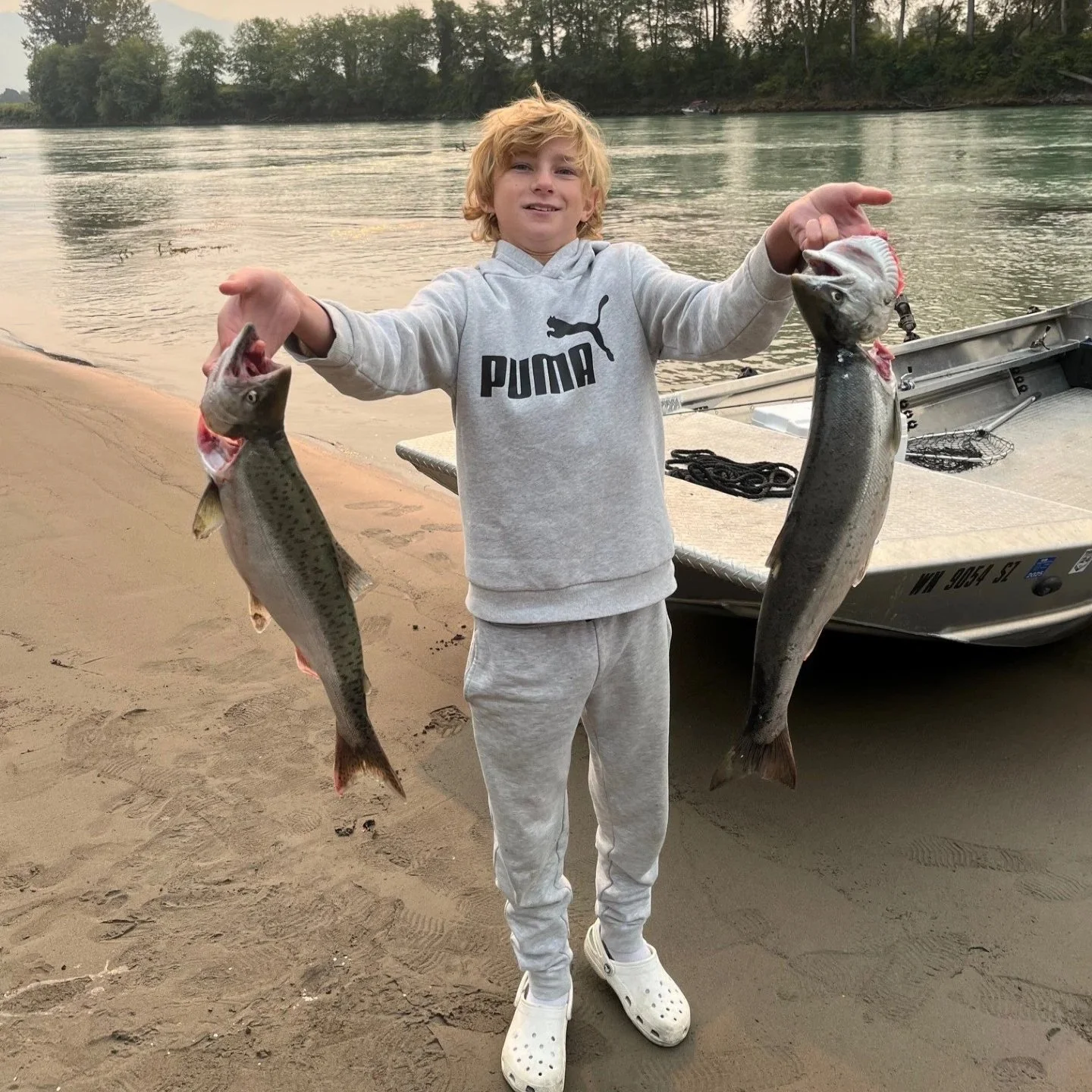 The boy with two salmon from the Skagit.