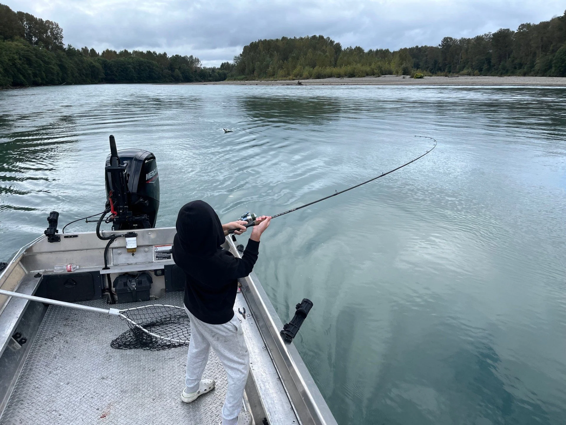 Tyler wrestling a coho salmon on the Skagit River.