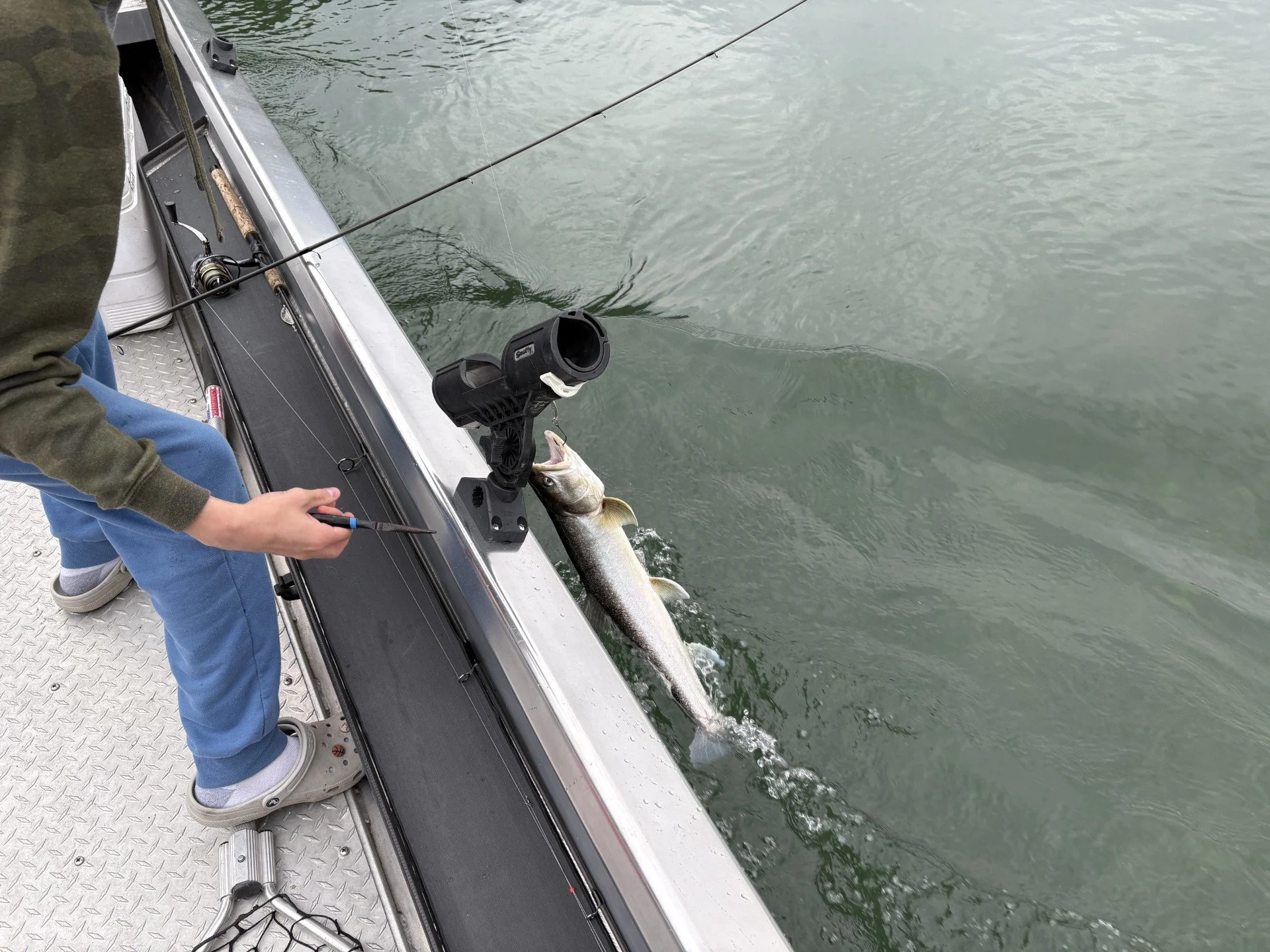 Tyler (my son) releasing a dolly varden on the Skagit River.