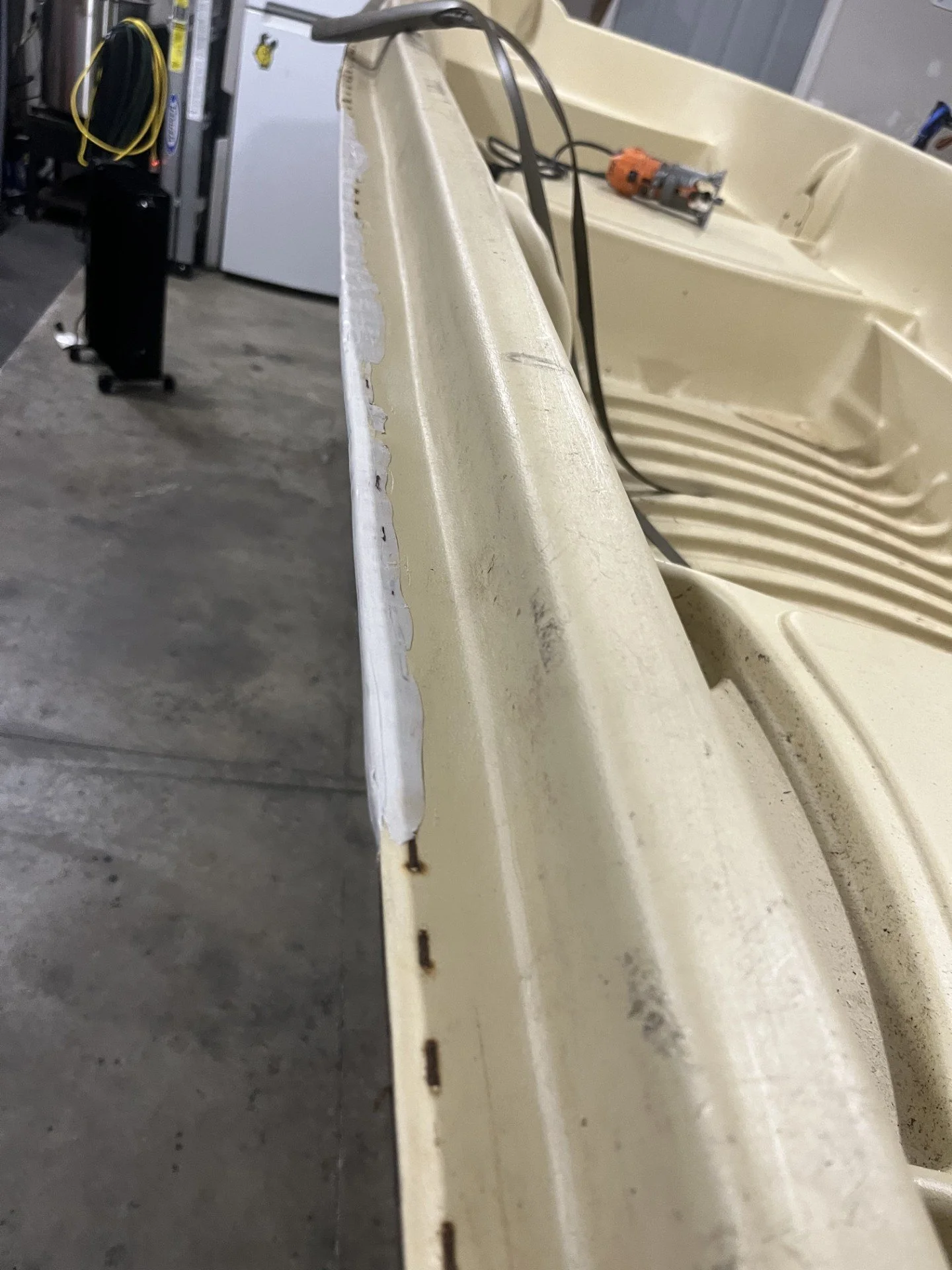 Repair work done to the seam of a rotomolded HDPE boat.  The seam was rebuilt before a trim piece was installed.