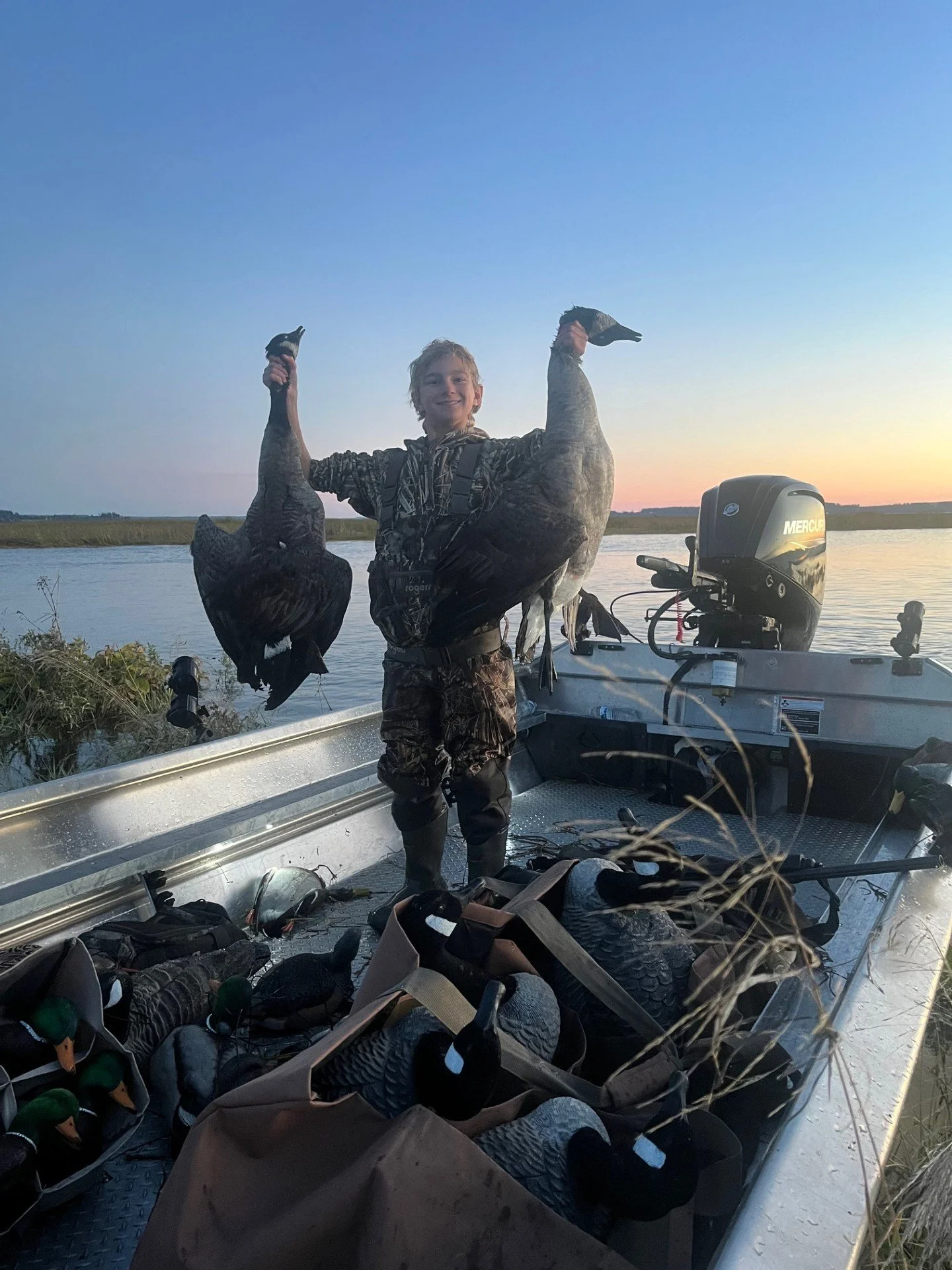 Tyler with a pair of Canada geese during the 2024 youth hunt on Skagit Bay.