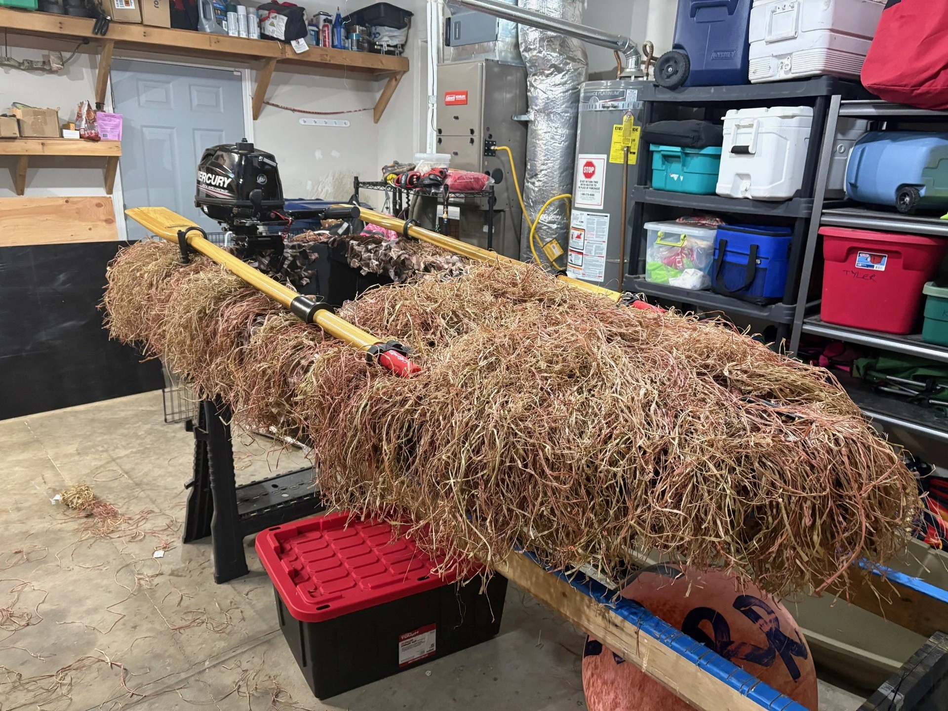 The welded HDPE layout boat after full grass-out and installation of an outboard motor.