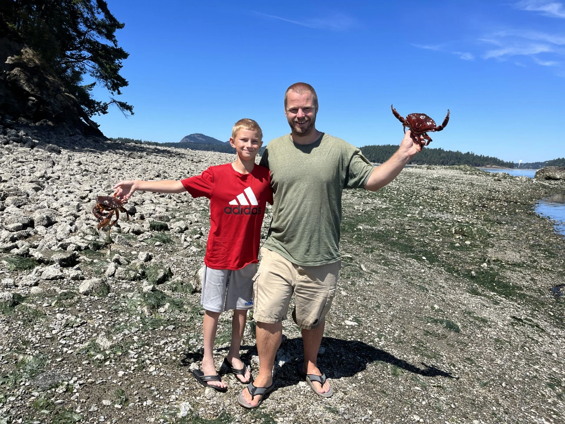 The boy and I on a crabbing trip.  We got off the boat and waded the shallows for some bonus rock crab.