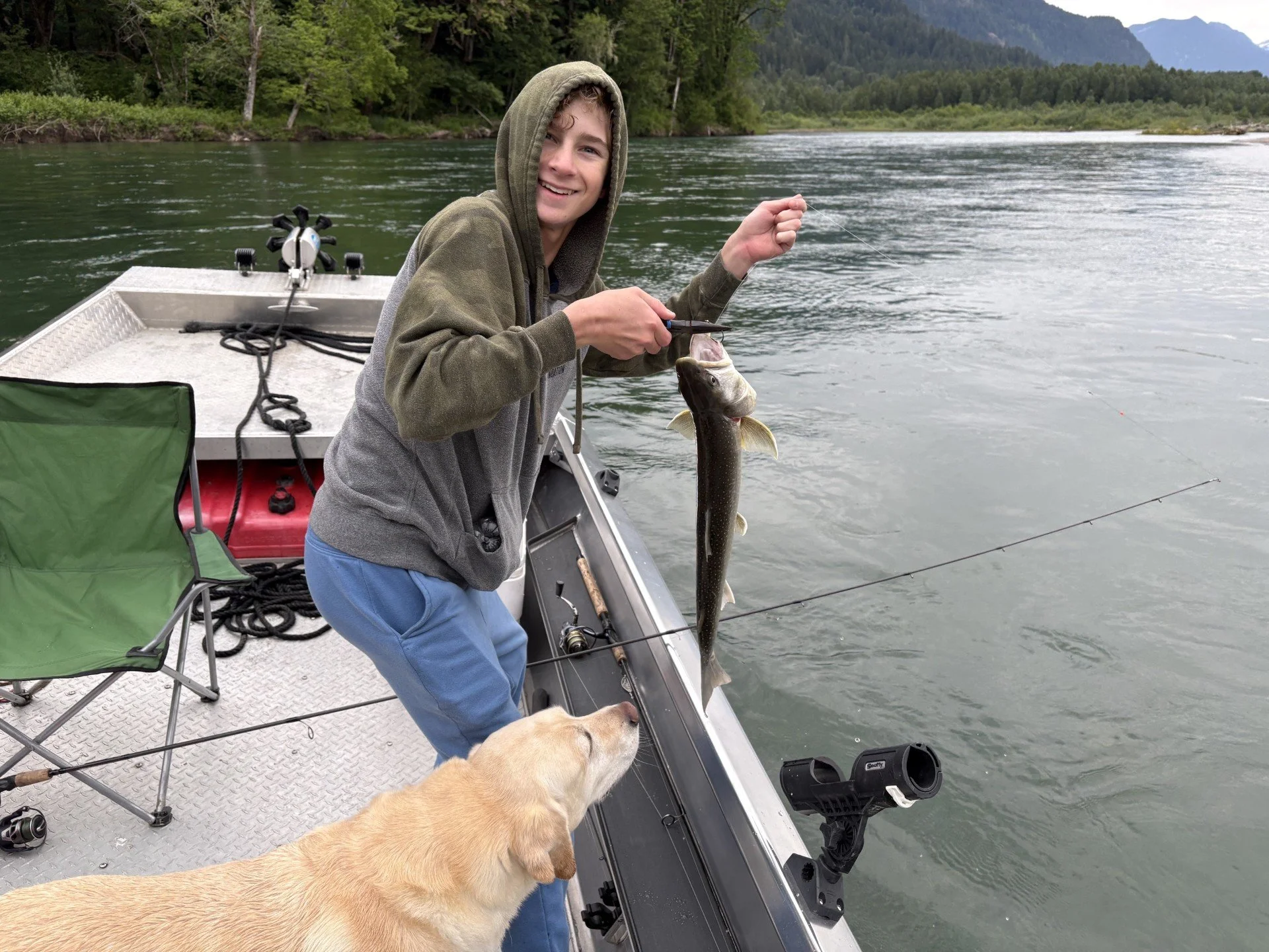 Tyler (son of Wyman Guide Service) with a gorgeous dolly varden off the Skagit River.