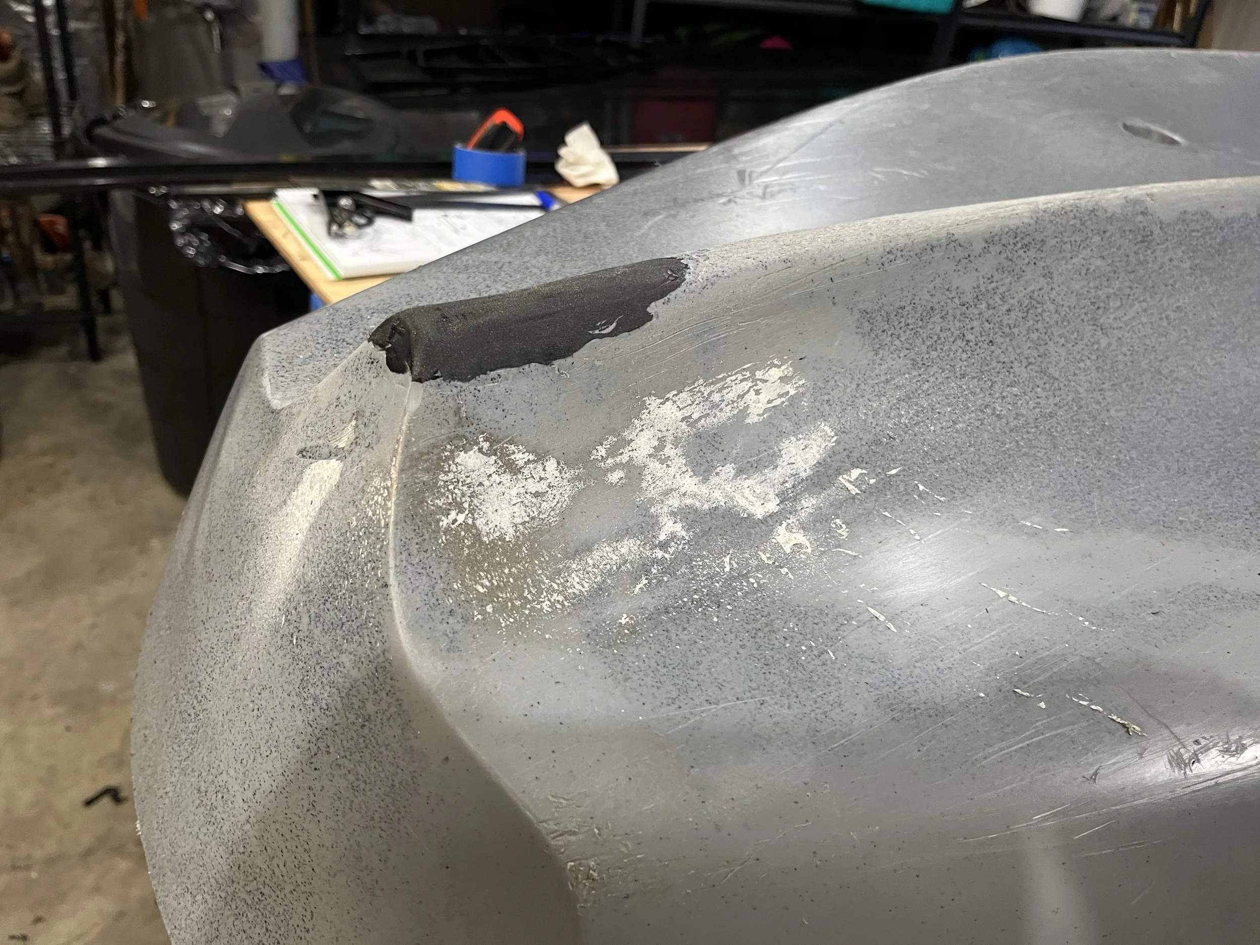A close-up of the repair work on the kayak keel.  Didn't have a matching color at the time.  Use black HDPE weld wire.