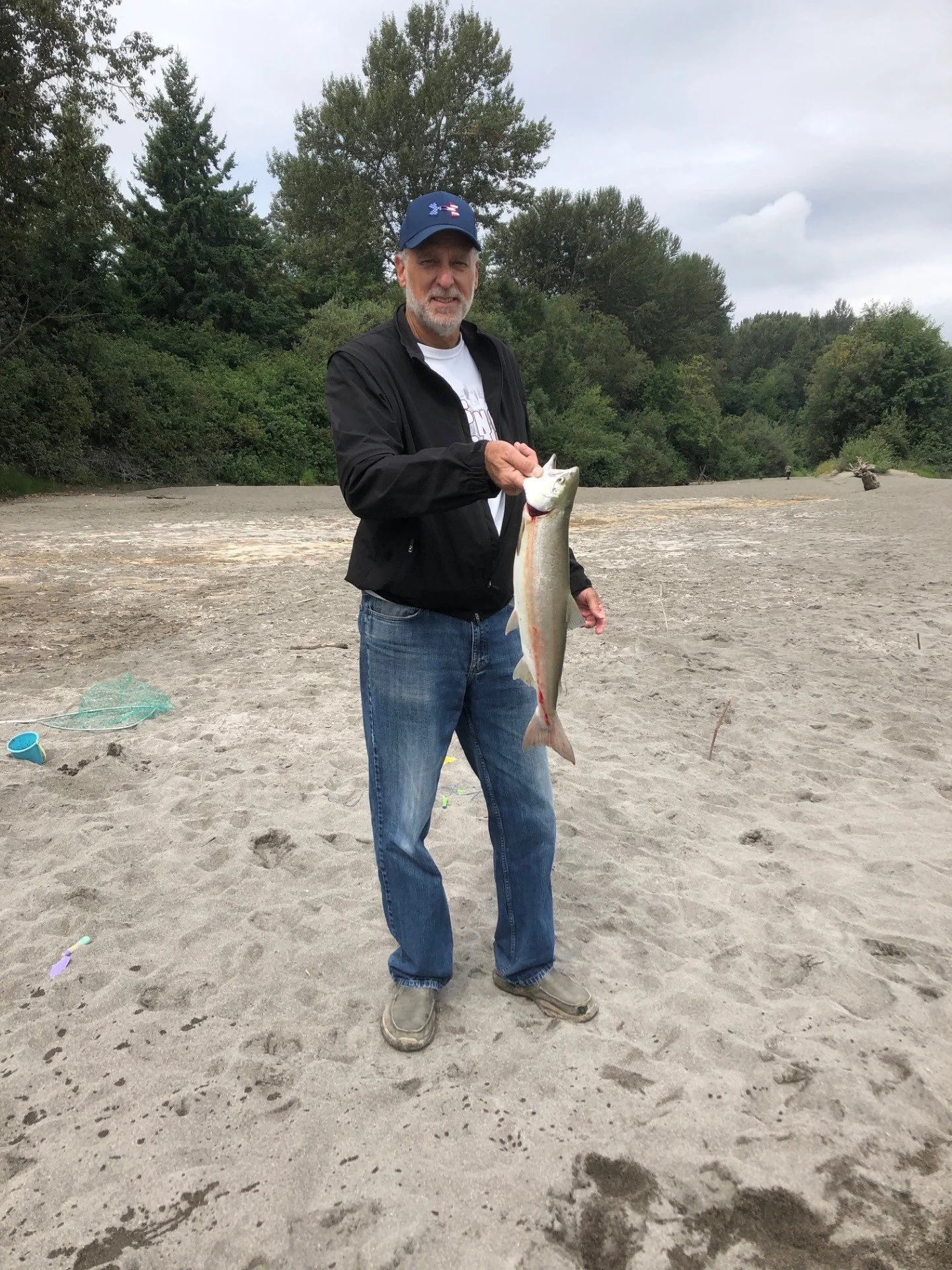 Wyman Guide Service's father-in-law with a salmon he caught on the Skagit River.